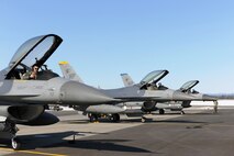 EIELSON AIR FORCE BASE, Alaska – Pilots from the 8th Fighter Wing prepare to taxi down the runway and fly simulated combat sorties April 15 during RED FLAG-Alaska at Eielson Air Force Base. RF-A is a Pacific Air Forces-directed field training exercise for the United States and allied forces to train under simulated air-combat situations. (U.S. Air Force photo/Staff Sgt. Thomas Skinkle)
