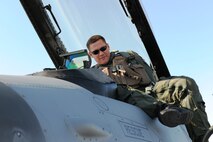 EIELSON AIR FORCE BASE, Alaska – Lt. Col. James Wilkerson, 80th Fighter Squadron commander, gets into his F-16 Fighting Falcon to fly a simulated combat sortie April 15 during RED FLAG-Alaska at Eielson Air Force Base. RF-A is a Pacific Air Forces-directed field training exercise for the United States and allied forces to train under simulated air-combat situations. (U.S. Air Force photo/Staff Sgt. Thomas Skinkle)
