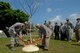 Brig. Gen. Kenneth Wilsbach, 18th Wing commander, and Tokujitsu Miyagi, former mayor of Kadena Town, plant a cherry blossom tree at Kenney Park April 22. The tree planting was part of celebrating Earth Day  at Kadena.(U.S. Air Force photo/Staff Sgt. Jonathan Steffen) 