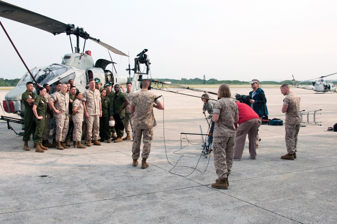 Brig. Gen. William D. Beydler, commanding general of 1st Marine Aircraft Wing, III Marine Expeditionary Force, and Marines from 1st MAW, film a commercial at the Marine Corps Air Station Futenma flightline April 29. The commercial launches the next phase of the “Not in My Corps” campaign, which condemns the use of Spice, a synthetic drug that produces marijuana-like effects.