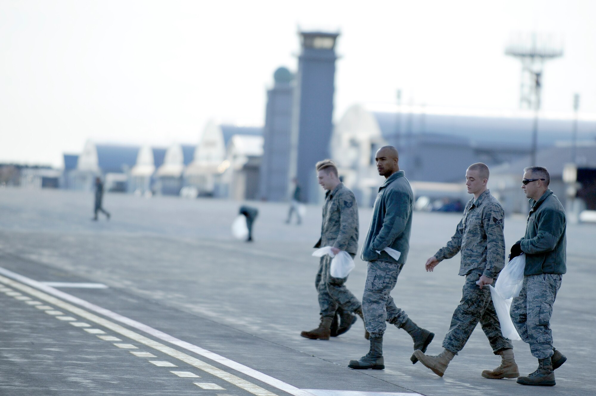 MISAWA AIR BASE, Japan -- Airmen walk the airfield looking for foreign object damage April 29. FOD walks are conducted to remove small pieces of foreign objects that can cause catastrophic damage to an aircraft. (U.S. Air Force photo/Staff Sgt. Marie Brown/Released)
