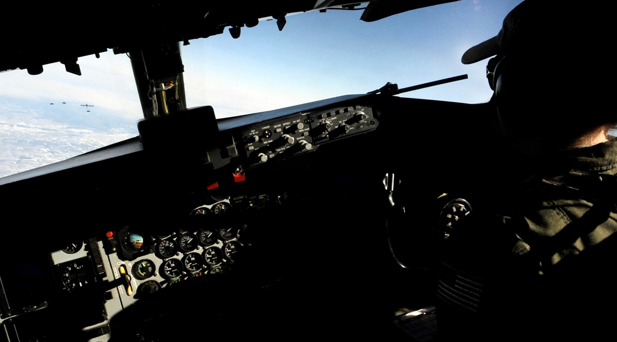 1st Lt. Emma House?s KC-135 Stratotanker is second in formation during an air refueling mission supporting RED FLAG-Alaska 11-1 April, 26, 2011, Eielson Air Force Base, Alaska. RF-A is a Pacific Air Forces-directed field training exercise for United States and allied forces to train under simulated air-combat situations. Lieutenant House is a pilot assigned to the 126th Air Refueling Wing, 906th Air Refueling Squadron, Scott Air Force Base, Ill. (U.S. Air Force photo/Airman 1st Class Laura Goodgame) 