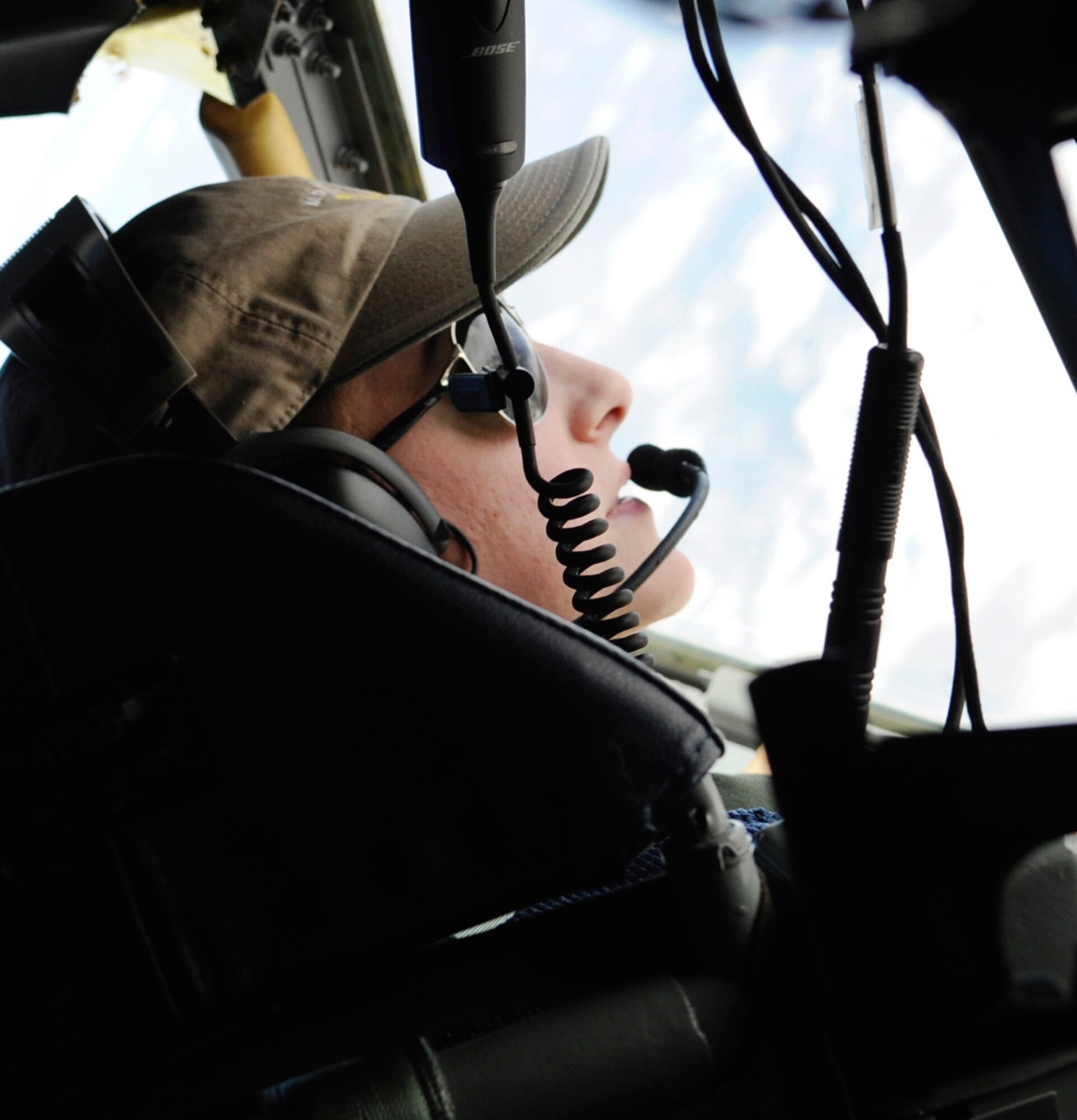 1st Lt. Emma House looks for Aggressors while airborne in a KC-135 Stratotanker RED FLAG-Alaska 11-1 April, 26, 2011, Eielson Air Force Base, Alaska. RF-A is a Pacific Air Forces-directed field training exercise for United States and allied forces to train under simulated air-combat situations. Lieutenant House is a pilot assigned to the 126th Air Refueling Wing, 906th Air Refueling Squadron, Scott Air Force Base, Ill. (U.S. Air Force photo/Airman 1st Class Laura Goodgame) 