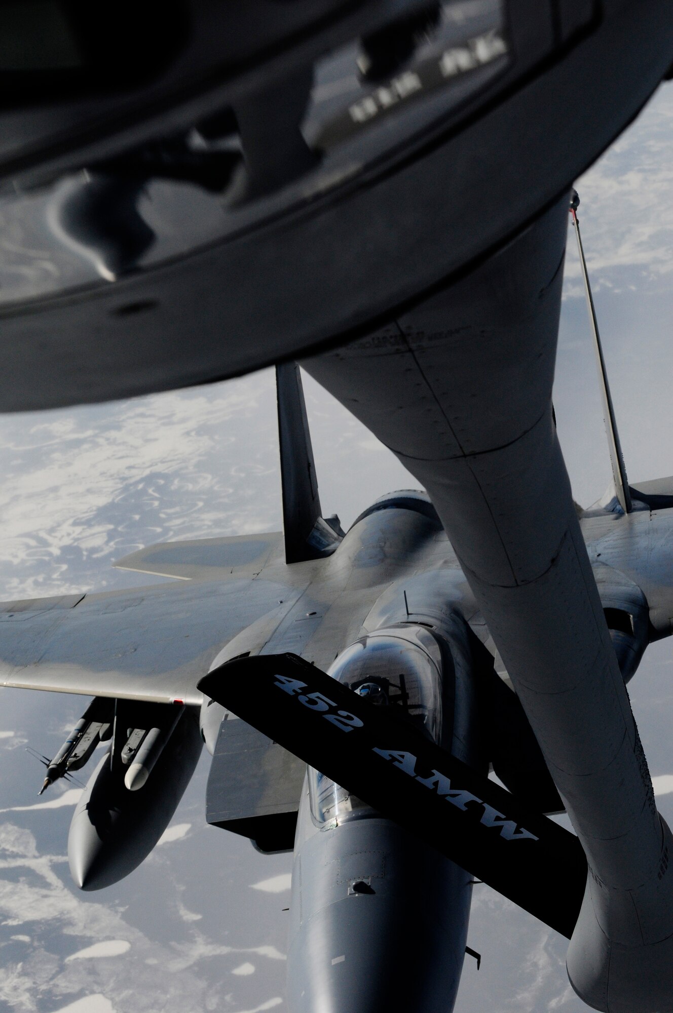 An F-15 Eagle approaches a KC-135 Stratotanker for in-flight-refueling during the RED FLAG-Alaska 11-1 April 26, 2011, Eielson Air Force Base, Alaska. RF-A is a Pacific Air Forces-directed field training exercise for United States and allied forces to train under simulated air-combat situations in the Joint Pacific Alaska Range Complex with over 67,000 square miles of air space, more than 30 threat simulators, one conventional bombing range, and two tactical bombing ranges containing more than 400 different types of targets. (U.S. Air Force photo/Airman 1st Class Laura Goodgame) 