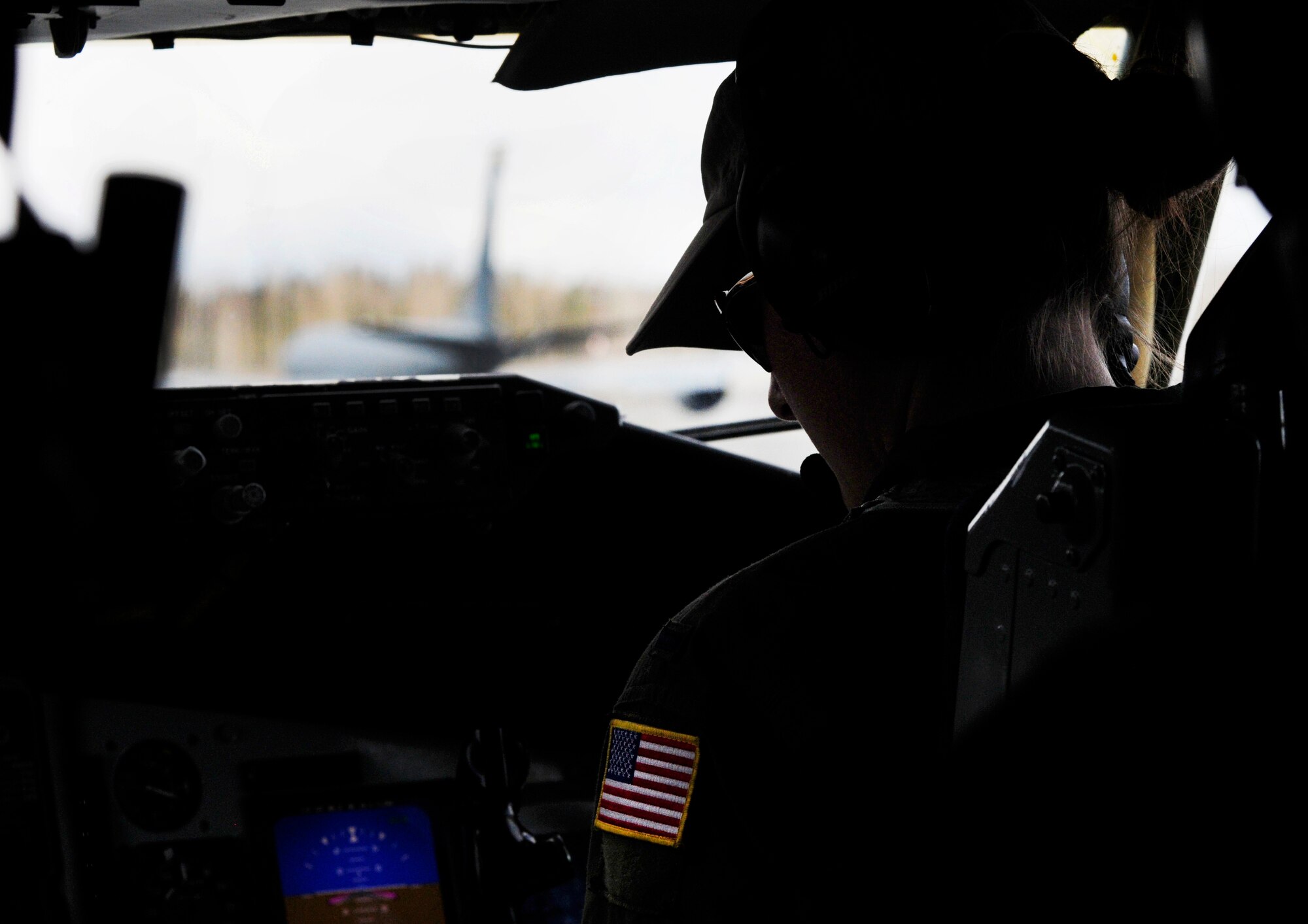 1st Lt. Emma House looks over gauges while taxing down the runway in a KC-135 Stratotanker during the RED FLAG-Alaska 11-1 exercise April, 26, 2011, Eielson Air Force Base, Alaska. RF-A is a Pacific Air Forces-directed field training exercise for United States and allied forces to train under simulated air-combat situations. Lieutenant House is a pilot assigned to the 126th Air Refueling Wing, 906th Air Refueling Squadron, Scott Air Force Base, Ill. (U.S. Air Force photo/Airman 1st Class Laura Goodgame) 