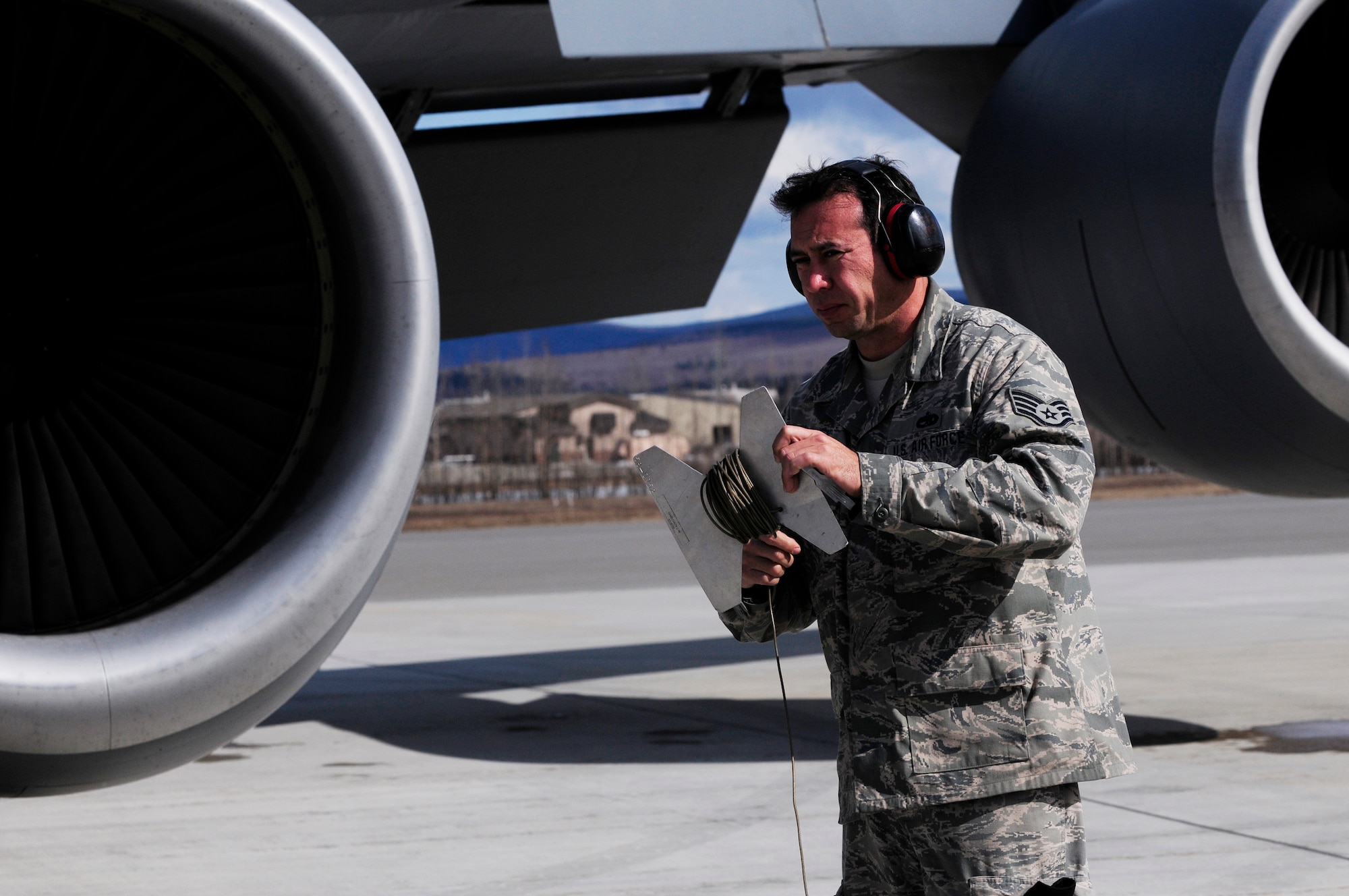 Staff Sgt. Sean Tao prepares a KC-135 Stratotanker for takeoff April 26, 2011, Eielson Air Force Base, Alaska. The KC-135 is an air refueling tanker aircraft vital to air combat missions. Air crew members gain invaluable experience during the RED FLAG-Alaska exercises by training under simulated air-combat situations.  Sergeant Tao is a crew chief assigned to the 154th Aircraft Maintenance Squadron, Hickam Air Force Base, Hawaii. (U.S. Air Force photo/Airman 1st Class Laura Goodgame)
