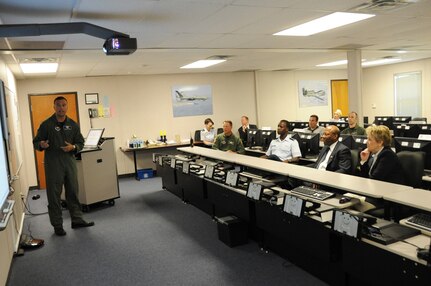 Dr. Clifford Stanley, Under Secretary of Defense for Personnel and Readiness, receives a brief at the 558th Flying Training Squadron April 27 at Randolph Air Force Base, Texas.  The brief was given by Lt. Col. Scott Cerone of the 558th FTS.(U.S. Air Force photo/Melissa Peterson)