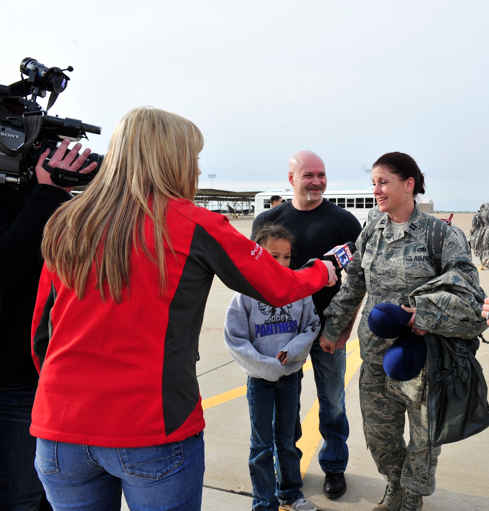 Upon her return from Afghanistan, Capt. Nancy Immormino, 419th Aircraft Maintenance Squadron, answers questions posed by a local reporter. (U.S. Air Force photo/Kim Cook)