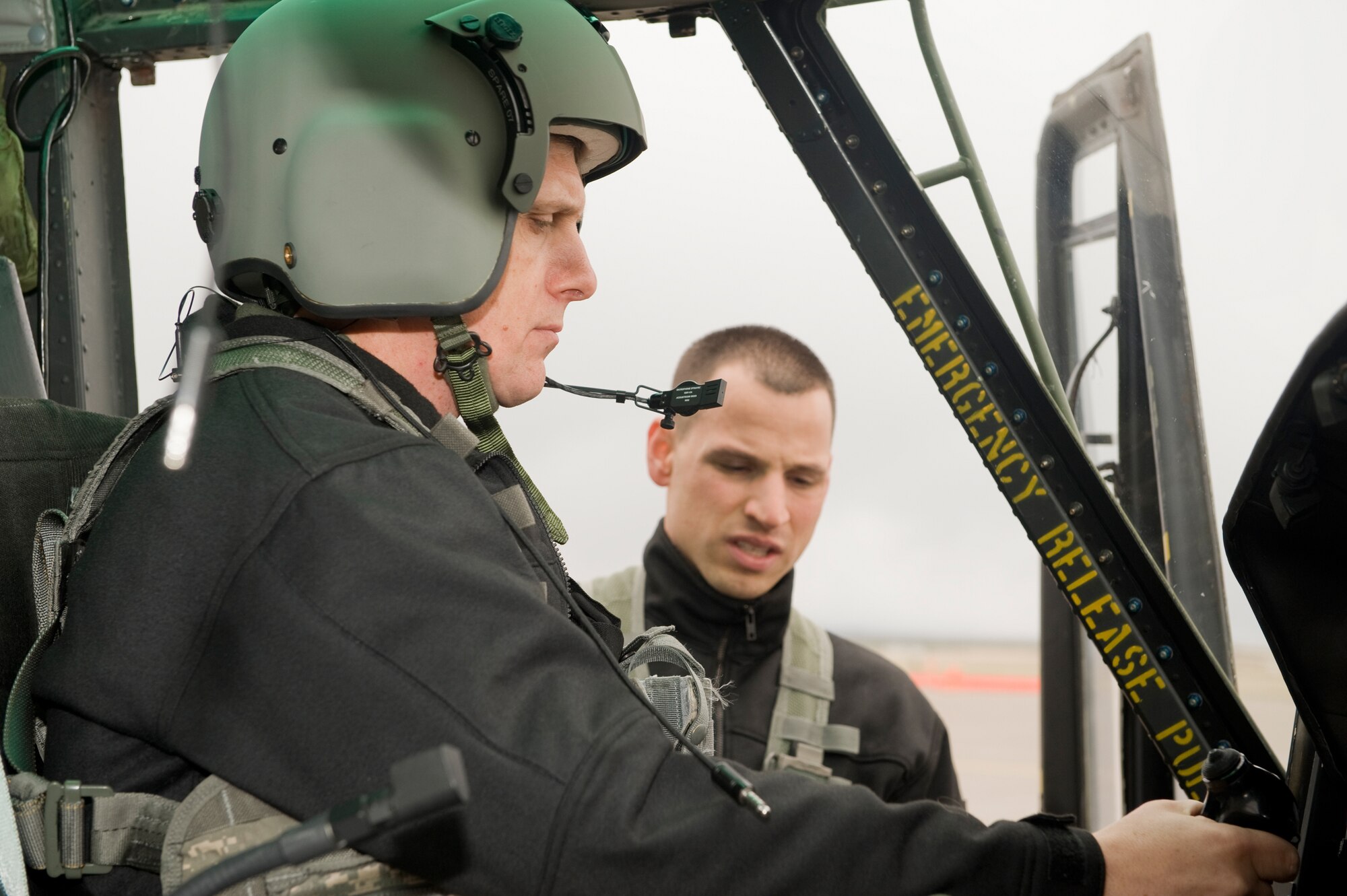 Brig. Gen. Timothy Ray, Air Force Global Strike Command's Air, Space and Operations Chief, gets himself familiar with the UH-1N helicopterbefroe flying a sortie under the instruction of Capt. David Nelson, 40th Helicopter Squadron pilot. General Ray visited with 341st Operations Group sections during a visit to Malmstrom April 25-26. (U.S. Air Force photo/Beau Wade)