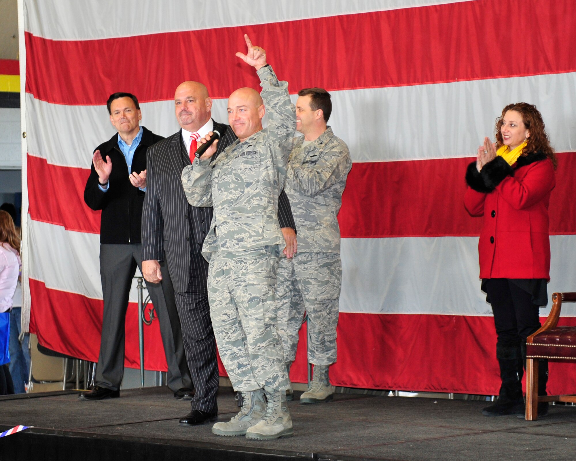 Col. Scott Long, 388th Fighter Wing commander, congratulates more than 200 Airmen upon their arrival at Hill Air Force Base. He's joined by his wife, Staci; Col. Keith Knudson, 419th Fighter Wing commander; Layton Mayor Steve Curtis (second from left) and Peter Jenks (far left), district director for Rep. Rob Bishop (R-Utah). (U.S. Air Force photo by Kim Cook)