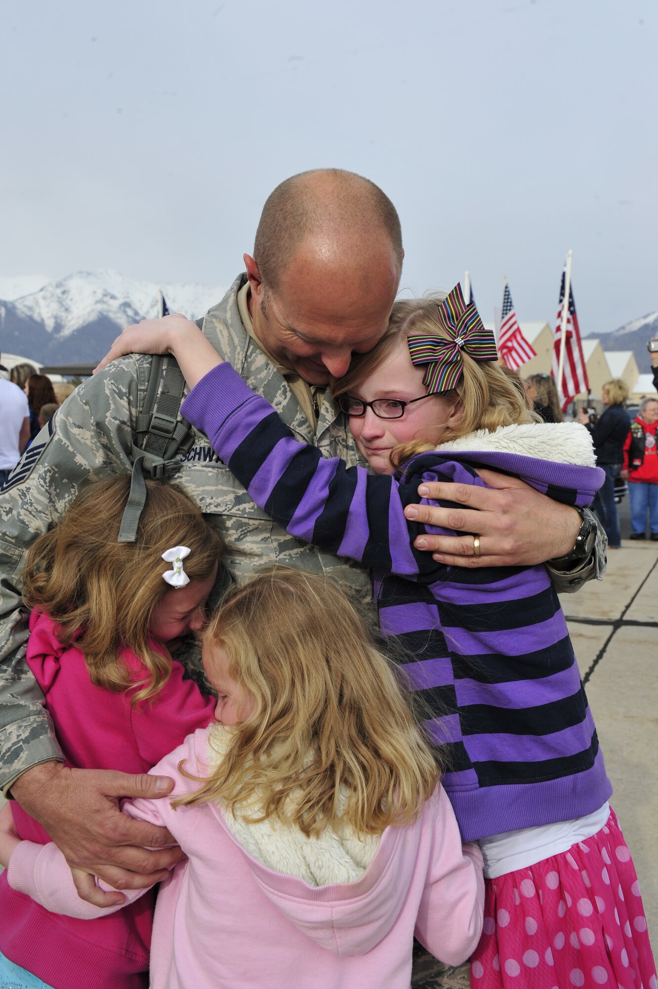 Master Sgt. Jonathan l. Schwartz, 388th Equipment Maintenance Squadron, is welcomed with open arms and huge hugs from his children, as he arrives home from deployment. (U.S. Air Force photo by Kim Cook)