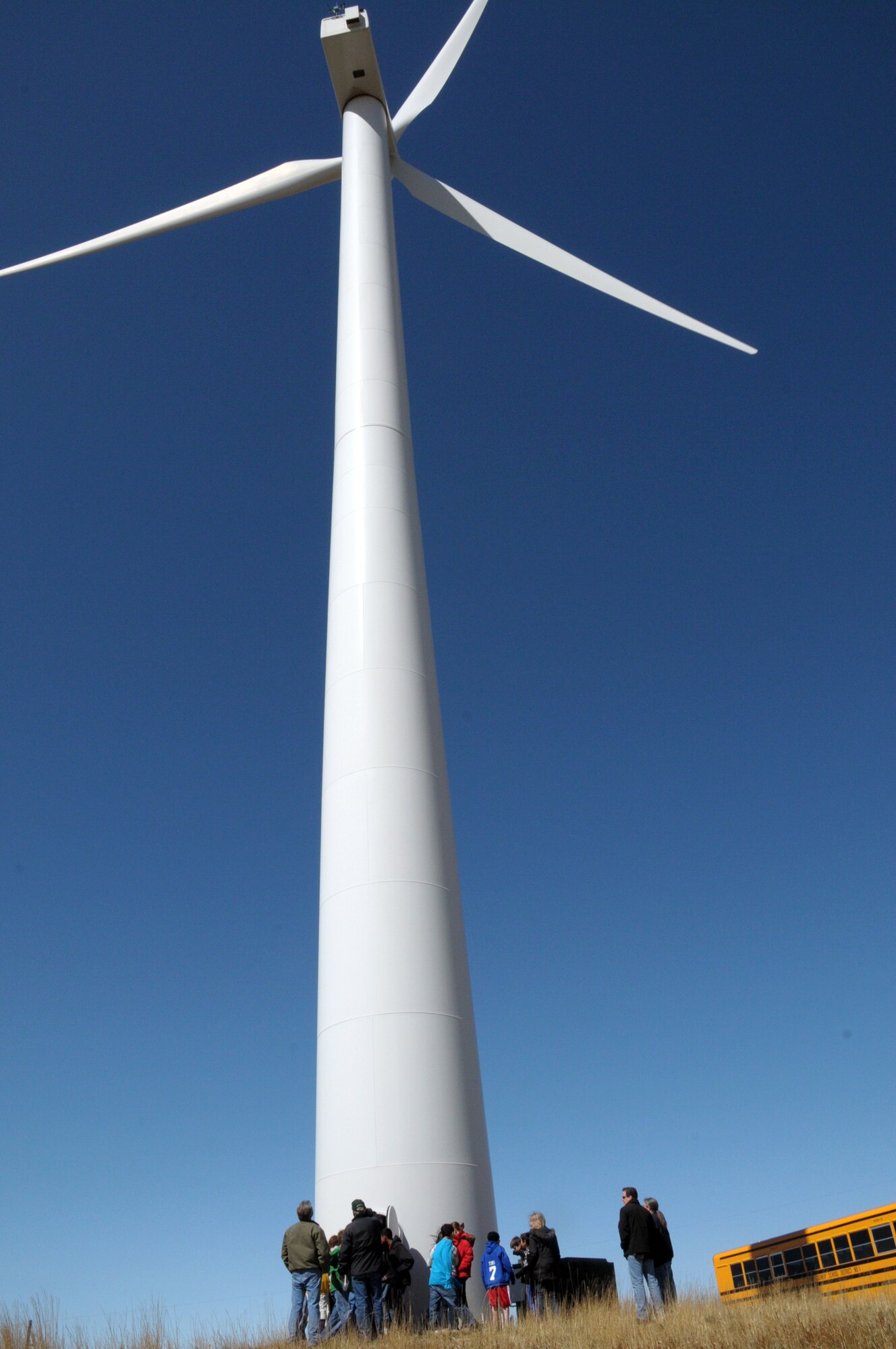 Children from Freedom Elementary get a close-up look at one of F. E. Warren's windmills during a tour of the bases conservation efforts April 21. (U.S. Air Force photo by Blaze Lipowski)