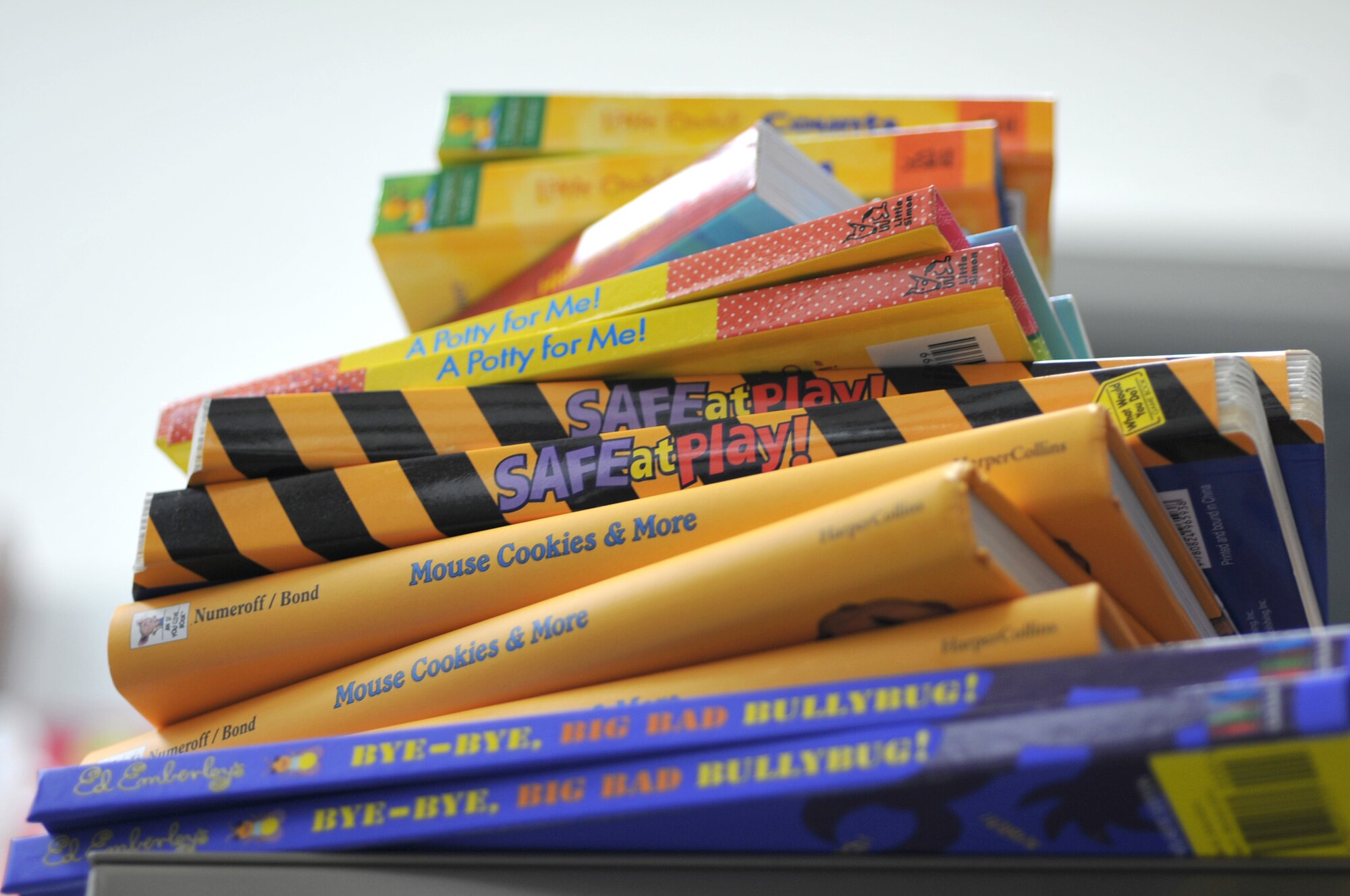 A stack of books sits on a supply shelf April 27, 2011, at the 374th Medical Operations Squadron Pediatric Clinic at Yokota Air Base, Japan. The books were donated by the Reach Out and Read Program, headquartered in Boston, to promote early literacy, childhood developement and improved listening and hearing skills in children. (U.S. Air Force photo/Airman John Partlow)

