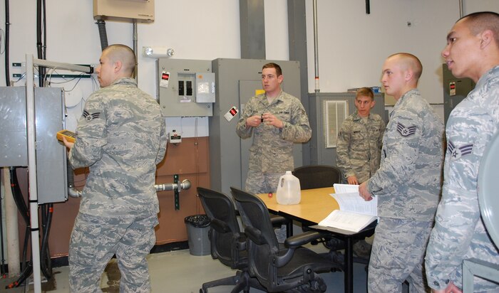 Members of the Periodic Maintenance Team Papa 02 prepare to run some drills in the T-22 trainer April 26. From left to right are Senior Airmen Alejandron Cedillos, Jeffrey Estes, Eric Menger, Staff Sgt. Kyle Babbert and Senior Airman Ray Deleon Guerrero. Missing from the photo are Senior Airment Jonathan Hudock, who was on leave, and Wayne Reid, who was deployed with another team. (U.S. Air Force photo/Valerie Mullett)