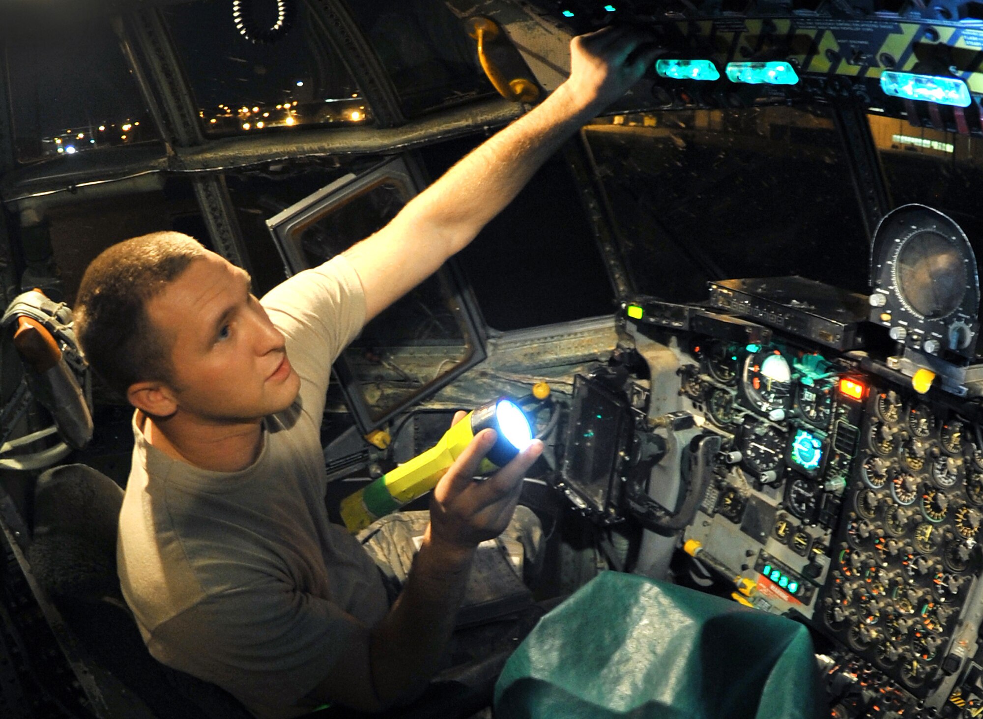 Airman 1st Class Steven Nesselrotte checks the lights inside a C-130 Hercules April 14, 2011, at Little Rock Air Force Base, Ark. Airman Nesselrotte is a crew chief assigned to the 19th Aircraft Maintenance Squadron. (U.S. Air Force photo/Airman 1st Class Rusty Frank)
