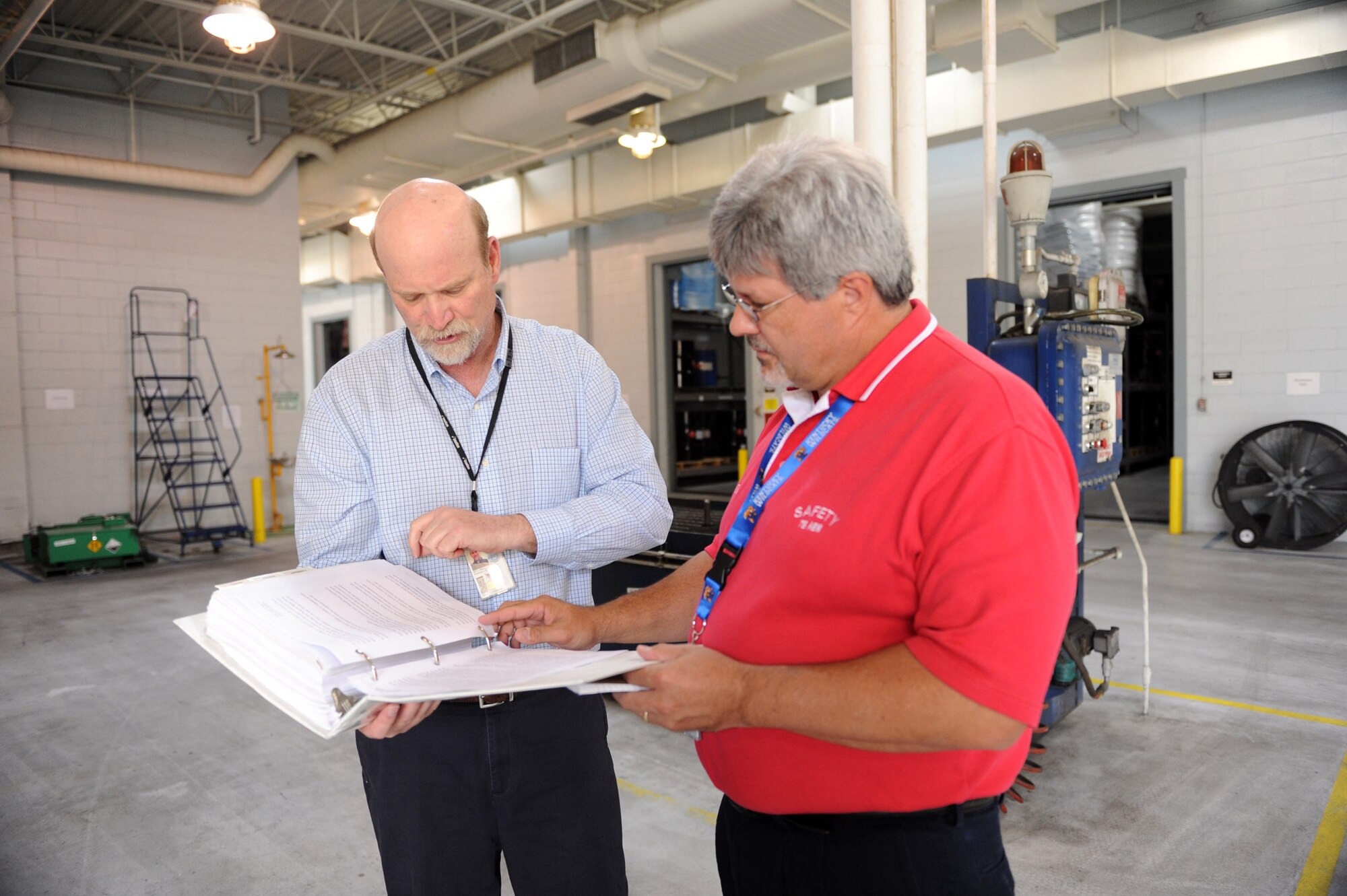 Randy Stillwell, Hazardous Waste Operations section chief, discusses his unit's safety plan with Dave Decker, 78th Air Base Wing ground safety manager. The section has not sustained a lost workday injury for 1,147 days and counting. U. S. Air Force photo by Ray Crayton