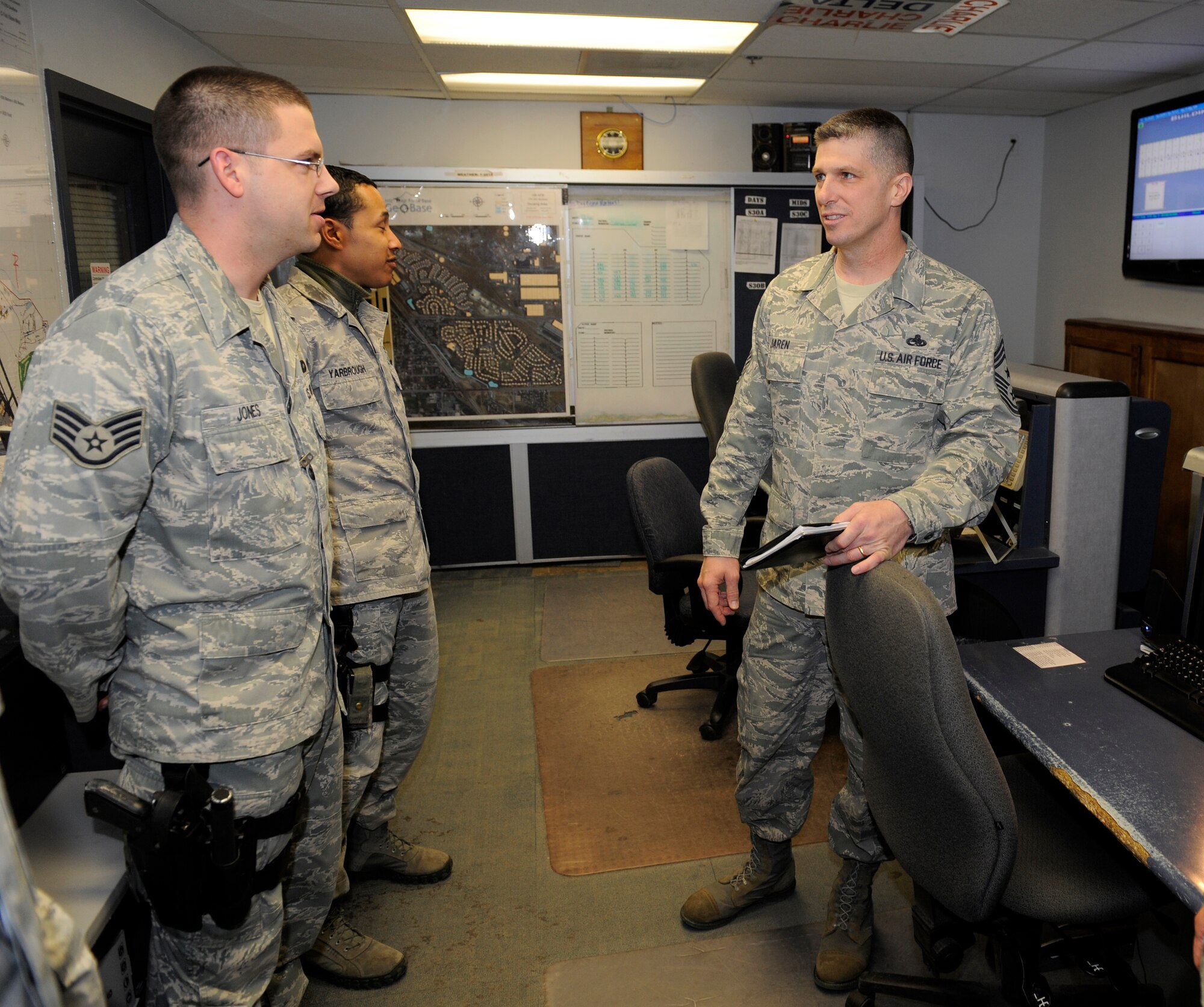 Chief Master Sgt. Eric Jaren (right), Air Force Materiel Command command chief, tours the 75th Security Forces Squadron. Staff Sgts. Ryan Jones (left), and Noah Yarbrough, both of the 75th SFS, talks with the command chief. Chief Jaren started his tour at the Utah Test and Training Range, then arrived at Hill Air Force Base to visit the greater part of the Ogden Air Logistics Center and other organizations within the 75th Air Base Wing. ( U.S Air Force photo by Todd Cromar)