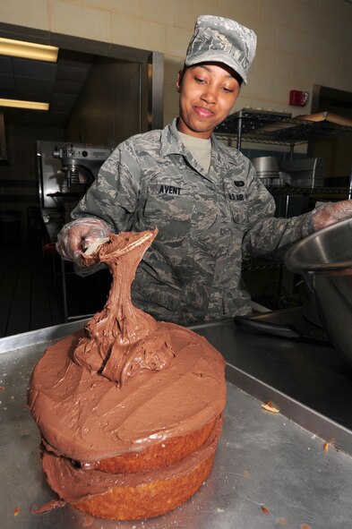 SEYMOUR JOHNSON AIR FORCE BASE, N.C. -- Airman 1st Class Precious Avent applies icing to a cake at the Southern Eagle Dining Facility here, April 28, 2011. Airman Avent said she enjoys baking and decorating pastries. Her dedication to her job earned her a spot in a culinary class at the Culinary Institute of America at Greystone Campus in St. Helena, Calif. Airman Avent is a 4th Force Support Squadron services journeyman and hails from Henderson, N.C. (U.S. Air Force photo/Senior Airman Rae Perry)