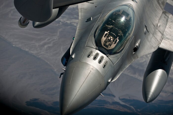 NELLIS AIR FORCE BASE, Nev. -- An F-16 Fighting Falcon from the 79th Fighter Squadron, Shaw AFB, S.C., moves into position to refuel from a KC-135 Stratotanker  from the 190 Air Refueling Wing, Forbes Field, Kan., during Green Flag West 11-6, April 27. Green Flag West replicates irregular warfare conditions currently found in Southwest Asia. Aircrews, work closely with Air Force joint terminal attack controllers. Pilots train for a missions such as close air support, and aerial reconnaissance.  (U.S. Air Force photo by Tech. Sgt. Michael R. Holzworth)


