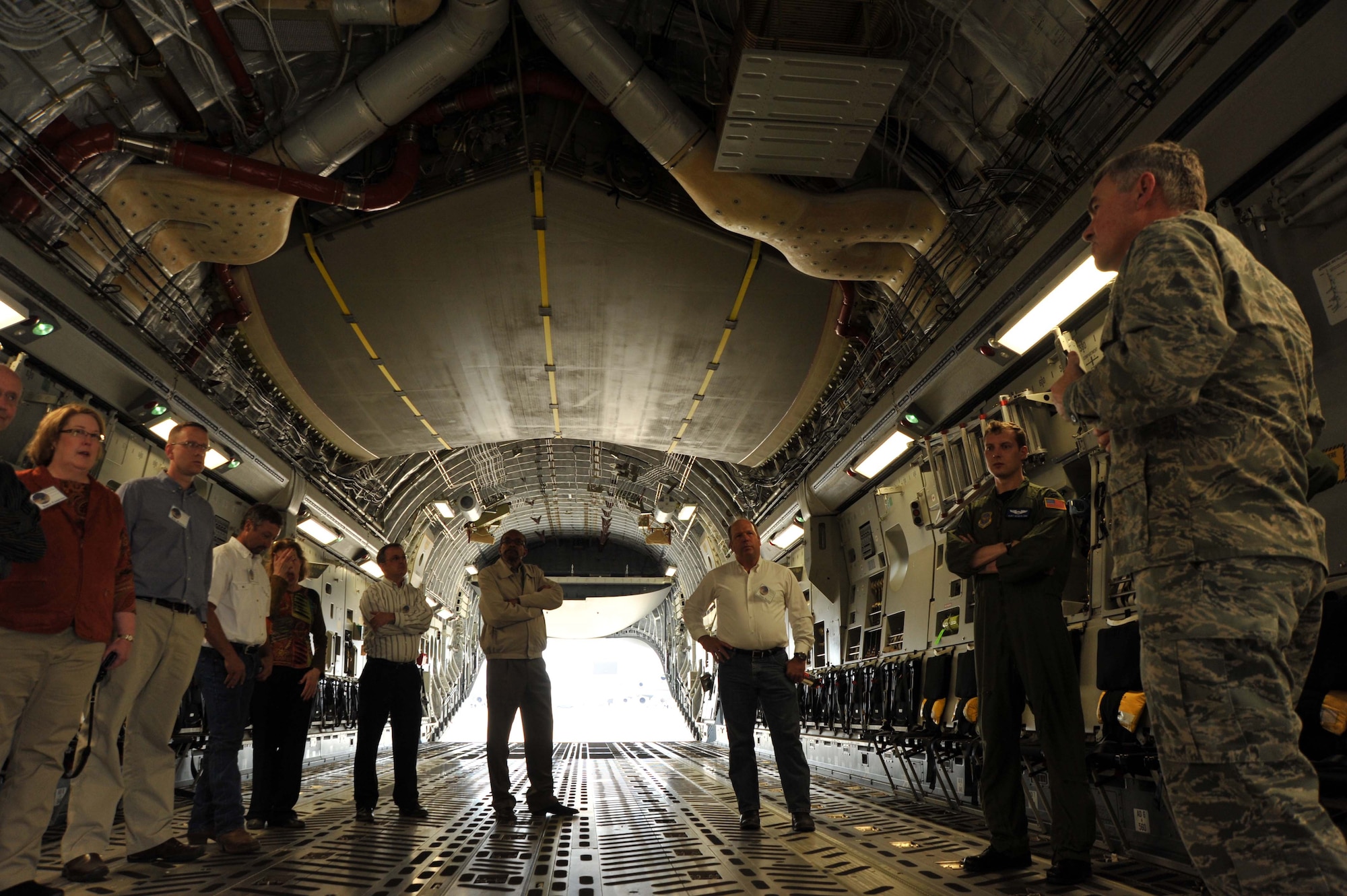 Kansas civic leaders tour the inside of a C-17 Globemaster April 20, 2011, Joint Base Mcguire-Dix-Lakehurst, N.J. The C-17 is the newest, most flexible cargo aircraft to enter the airlift force. The C-17 is capable of rapid strategic delivery of troops and all types of cargo to main operating bases or directly to forward bases in the deployment area.  (U.S. Air Force photo/Senior Airman Abigail Klein)
