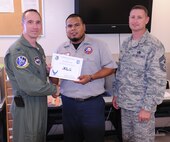 LAUGHLIN AIR FORCE BASE, Texas – Ramon Garcia, 47th Maintenance Directorate, poses with Col. Thomas Murphy, 47th Flying Training Wing vice commander, and Chief Master Sgt. Ray DeVite, 47th FTW command chief, after being presented the XLer of the Week award April 20. The XLer is a weekly award chosen by wing leadership and given to those who consistently make outstanding contributions to Laughlin and their unit. (U.S. Air Force photo by Airman 1st Class Blake Mize)