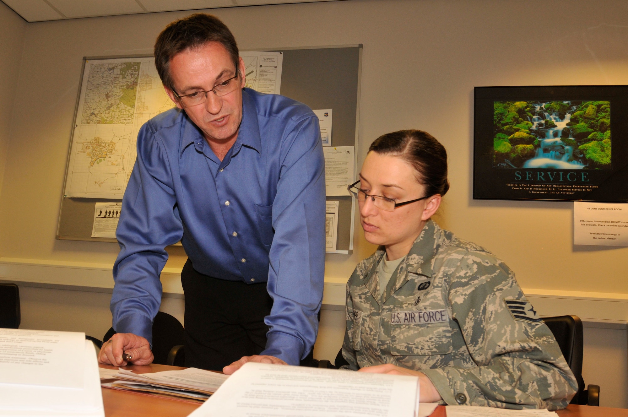 Darian Vomund, 48th Contracting Squadron contracting officer, reviews a contract with Staff Sgt. Zoryanna Siemer, 48th Contracting Squadron contracting specialist on April 27, 2011. Mr. Vomund was nominated for the Liberty Spotlight because he displayed the core of 'Excellence in All We Do'. (U.S. Air Force photo/Senior Airman Eboni Reams)
