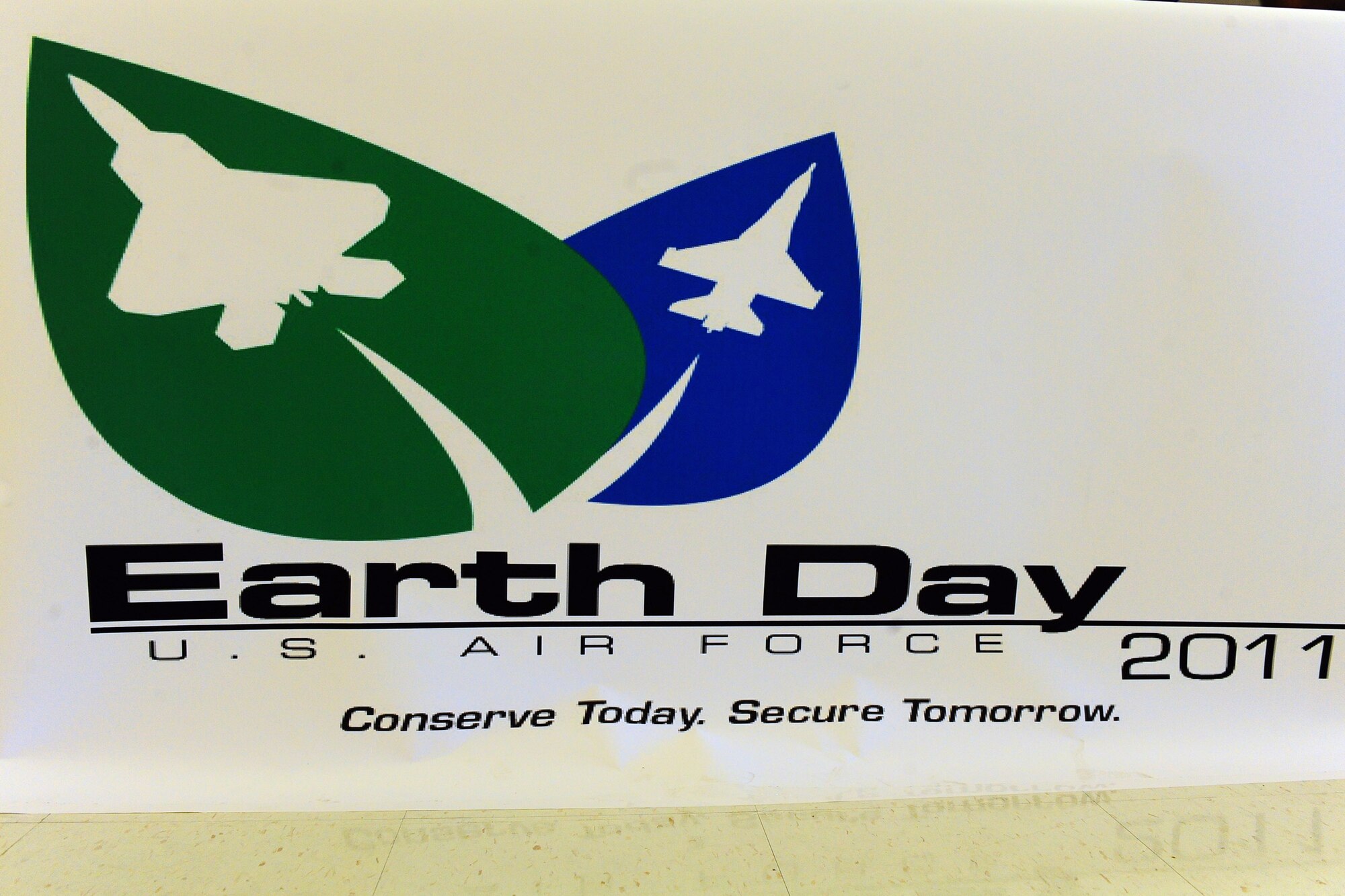 DYESS AIR FORCE BASE, Texas--7th Civil Engineer Squadron members setup an informational booth April 22 to pass out brochures and pamphlets about Earth Day at the base exchange here. T-shirts, thermoses, coffee mugs and reusable grocery bags, all marked with the Dyess Environmental Program logo, were passed out throughout the BX to promote Earth Day. 