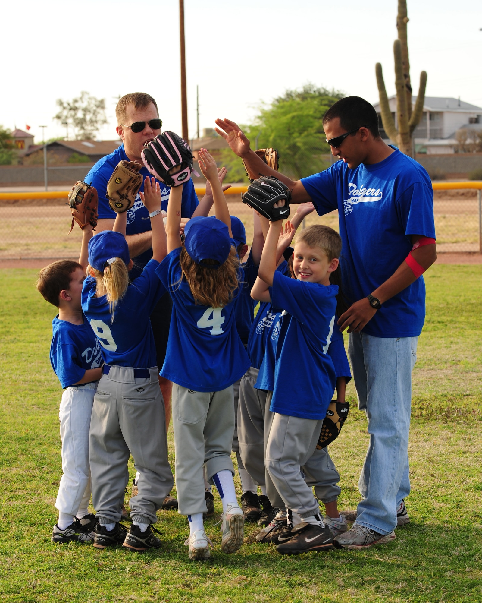 DAVIS-MONTHAN AIR FORCE BASE, Ariz. - The Davis-Monthan Dodgers break from a team huddle before a game at the Corsair ball field here April 20. Davis-Monthan currently has four tee ball teams comprised of children from the base community between the ages of five and six. (U.S. Air Force photo/Airman 1st Class Jerilyn Quintanilla)