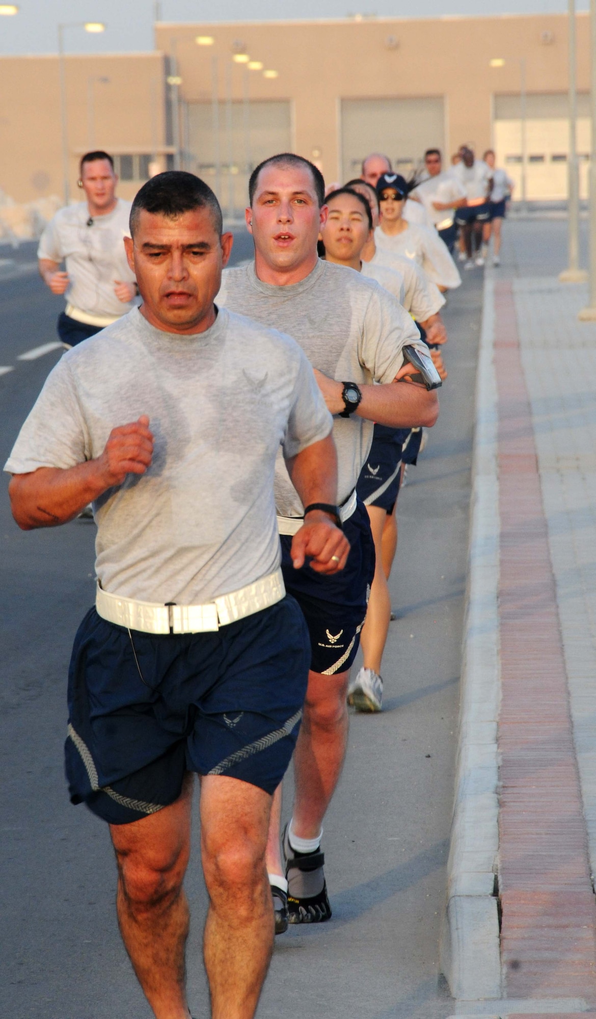 U.S. Air Force Airmen complete one of the four laps needed to complete a 10K run April 27 in Southwest Asia. The 10K was sponsored by the Stars & Stripes and had many participants. (U.S. Air Force photo/Staff Sgt. Anthony Graham)