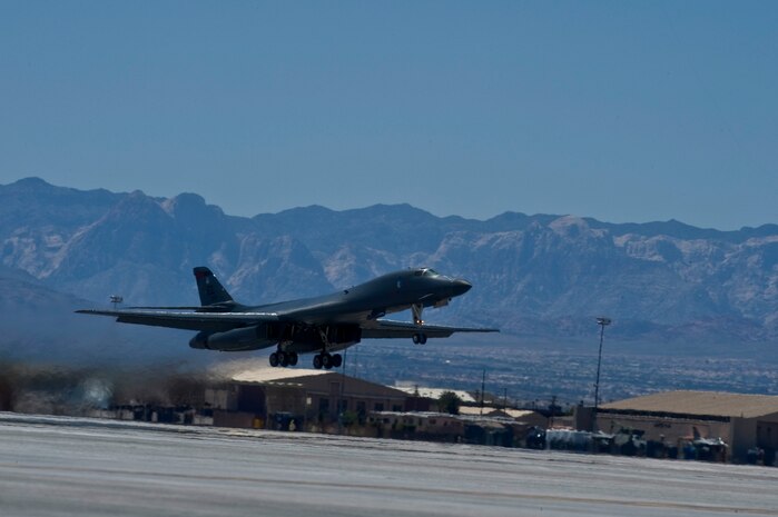 NELLIS AIR FORCE BASE, Nev. -- A  B-1 Lancer, from 34th Bomb Squadron, Ellsworth Air Force Base, S.D., takes off during Green Flag West 11-6, April 26.  Green Flag West replicates irregular warfare conditions currently found in Southwest Asia. Aircrews, work closely with Air Force joint terminal attack controllers. Pilots train for a missions such as close air support, and aerial reconnaissance. (U.S Air Force Photo by Airman 1st Class Daniel Hughes)