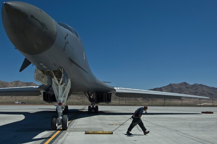 NELLIS AIR FORCE BASE, Nev. --Staff Sgt. William Hatton, crew chief from the 28th Aircraft Maintenance Squadron, Ellsworth Air Force Base, S.D., takes out final chalk from a B-1 Lancer during Green Flag West 11-6, April 26.  Green Flag West replicates irregular warfare conditions currently found in Southwest Asia. Aircrews, work closely with Air Force joint terminal attack controllers. Pilots train for a missions such as close air support, and aerial reconnaissance. (U.S Air Force Photo by Airman 1st Class Daniel Hughes)