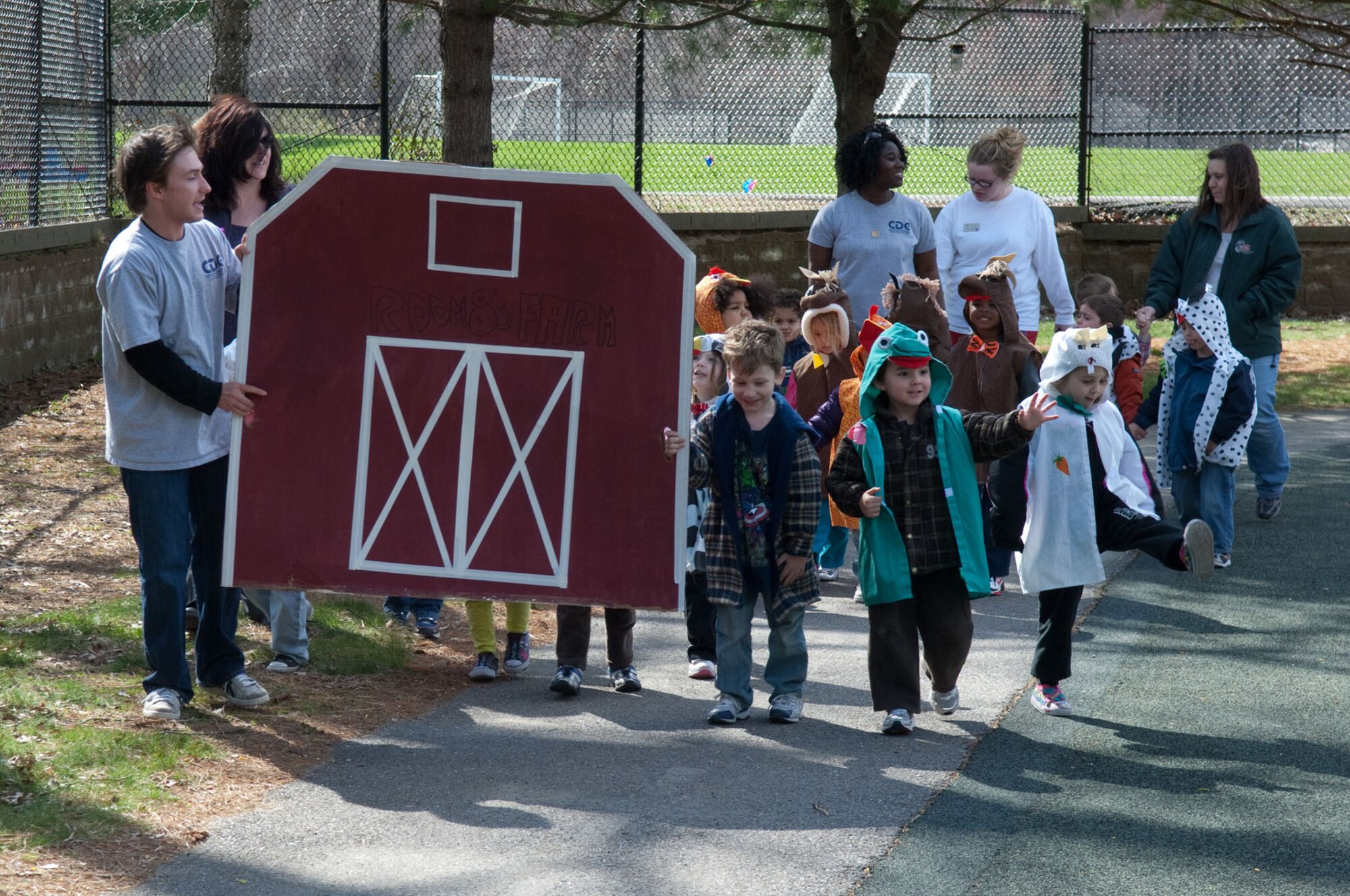HANSCOM AIR FORCE BASE, Mass. – Children dressed up as barnyard animals march around the Child Development Center during the Parade of Floats April 21. The parade was one of many events held to celebrate Month of the Military Child. (U.S. Air Force photo by Rick Berry)
