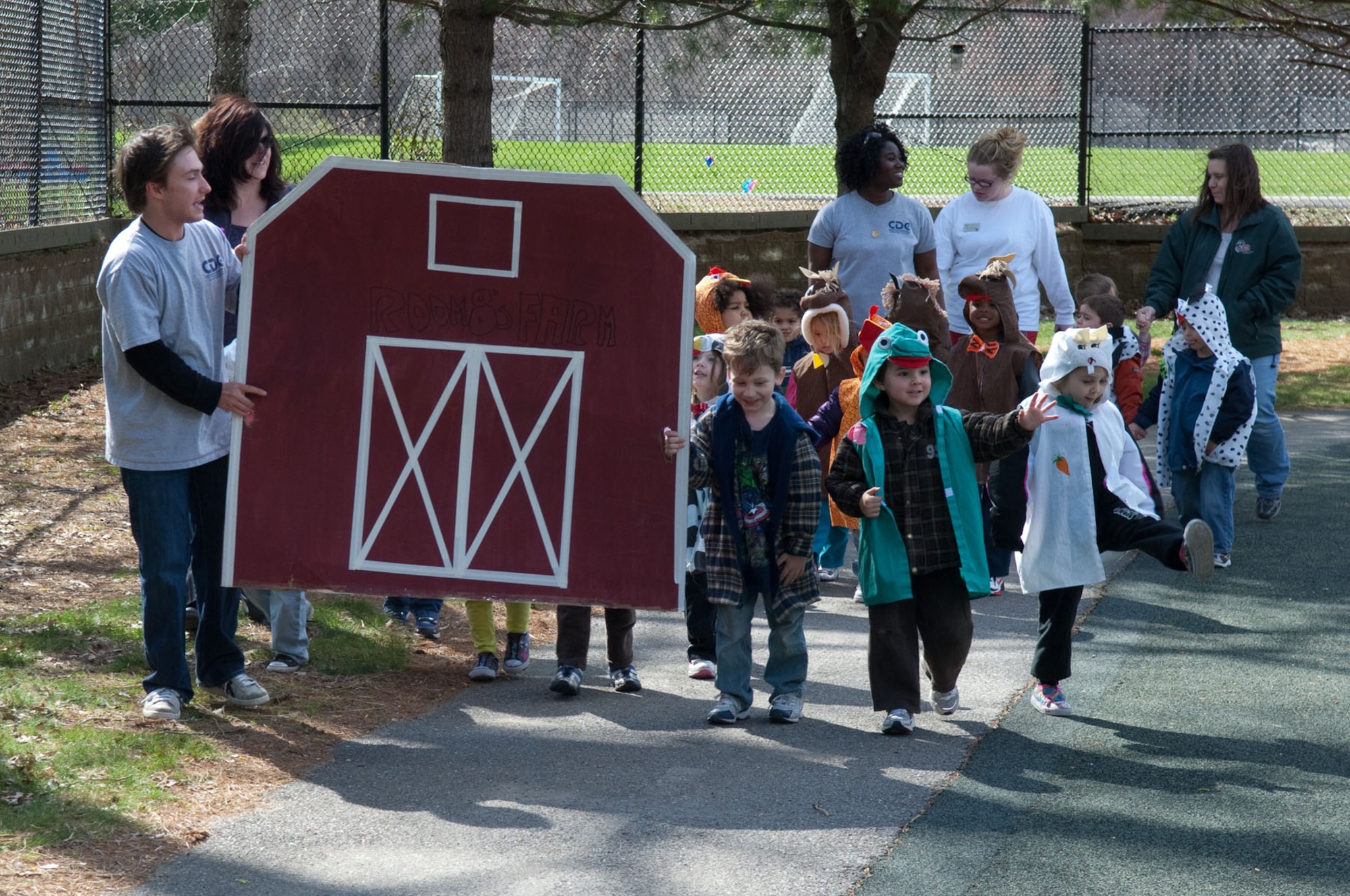 HANSCOM AIR FORCE BASE, Mass. – Children dressed up as barnyard animals march around the Child Development Center during the Parade of Floats April 21. The parade was one of many events held to celebrate Month of the Military Child. (U.S. Air Force photo by Rick Berry)