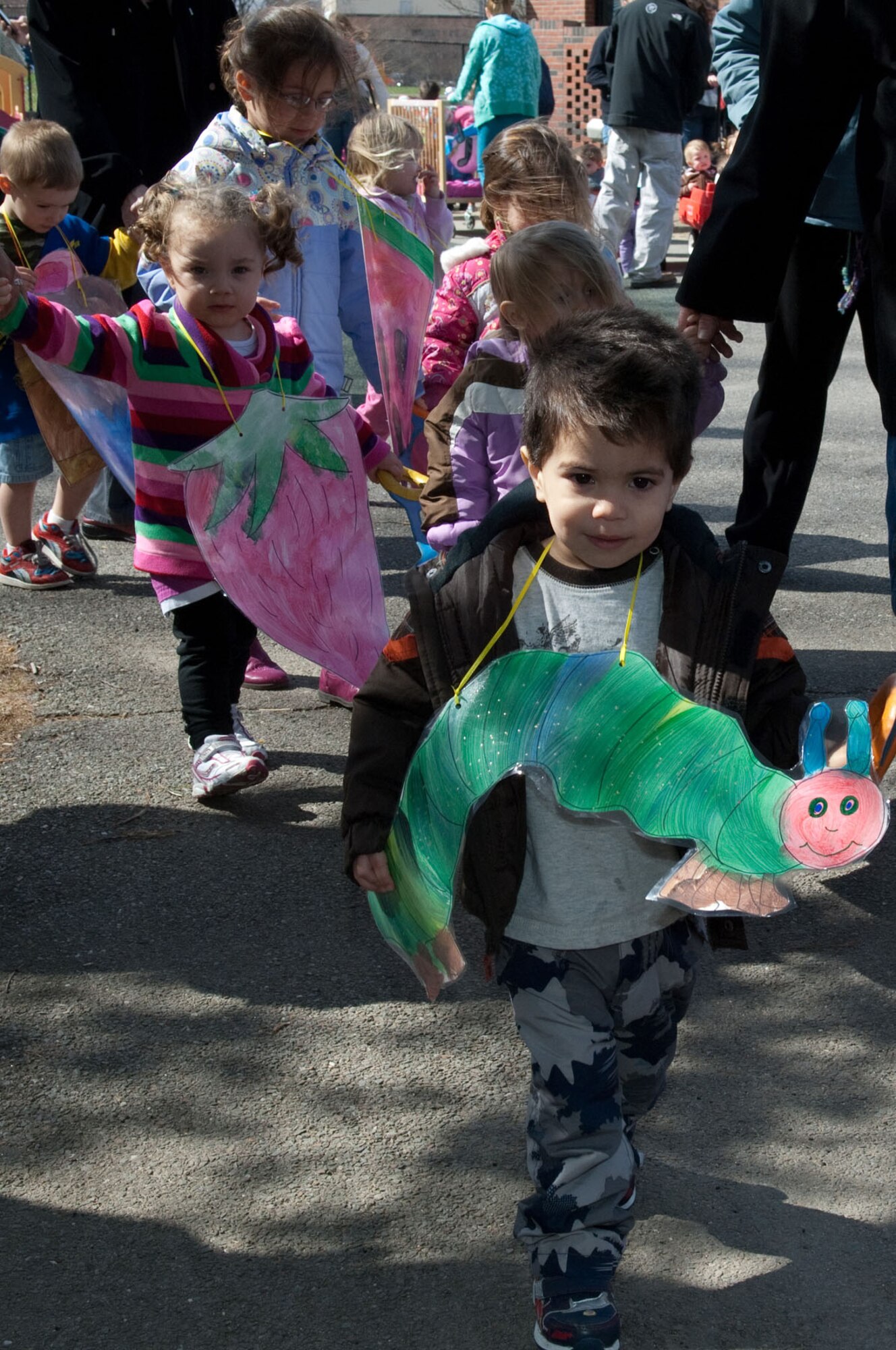 HANSCOM AIR FORCE BASE, Mass. – Diego Veglio (front) and other children prepare to march around the Child Development Center during the Parade of Floats April 21. Each room came up with a theme and the kids helped make their costumes for the event. (U.S. Air Force photo by Rick Berry)