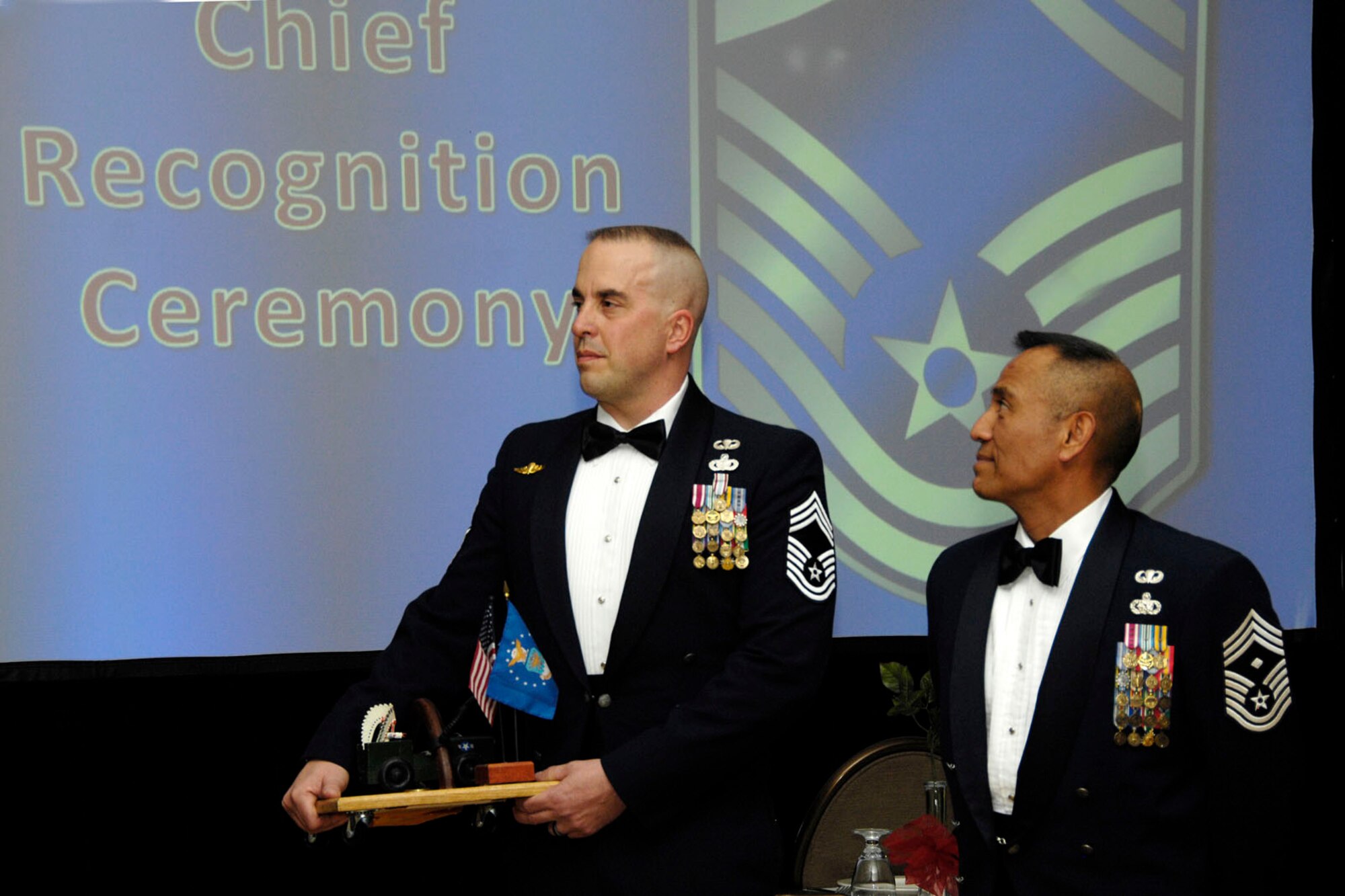 HANSCOM AIR FORCE BASE, Mass. – Chief Master Sgt. Chris Bostrom (left) and Chief Master Sgt. Raul G. Ruiz are honored during the Chief’s Recognition Ceremony at the Minuteman Club April 22. Chiefs Bostrom and Ruiz are Hanscom’s newest chief master sergeants. (U.S. Air Force photo by Linda LaBonte Britt)