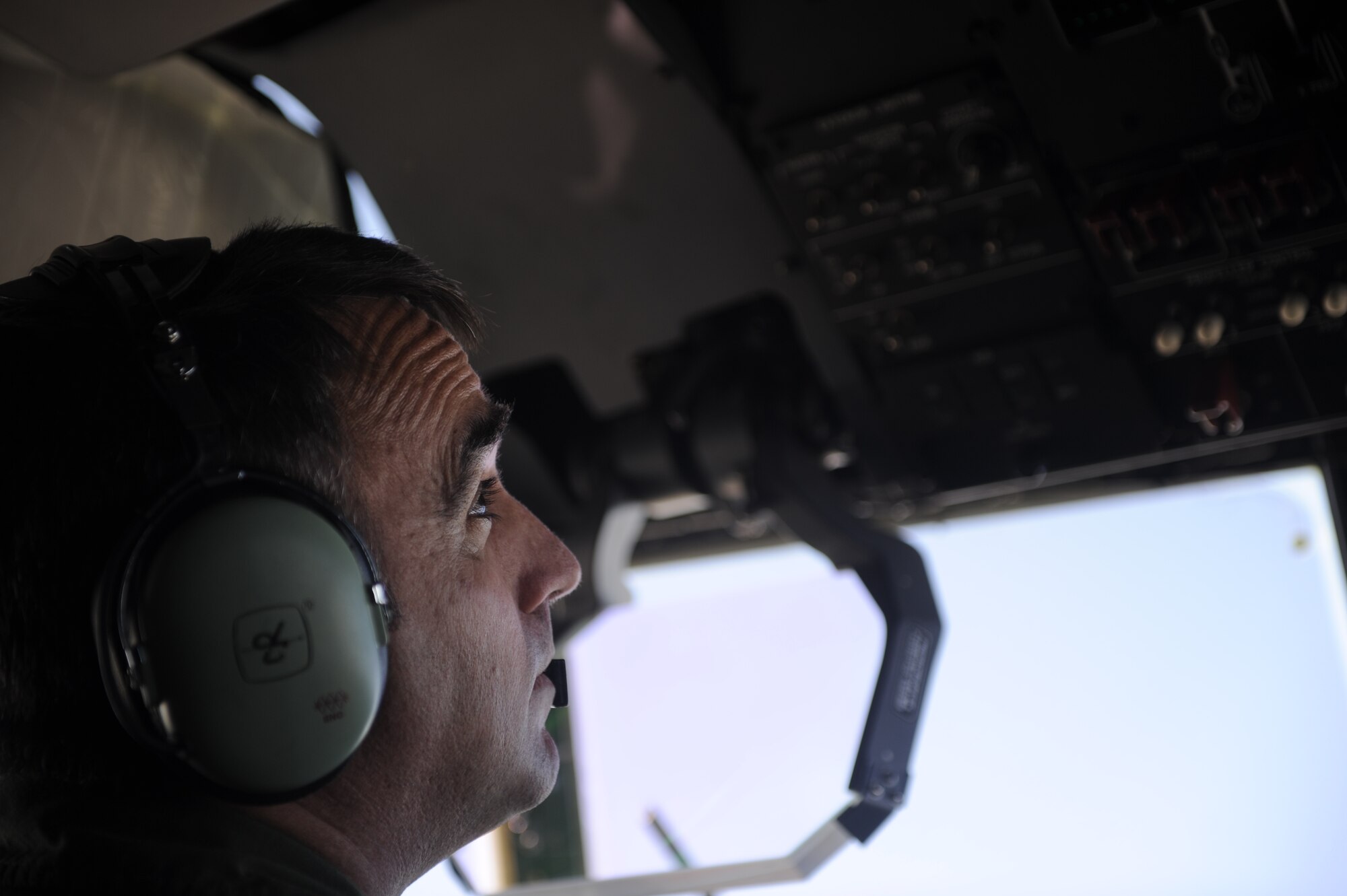 U.S. Air Force Lt. Col. Robert Allen, 115th Airlift Squadron, California Air National Guard, prepares to drop a line of fire retardant while aboard a C-130J Hercules over West Texas, April 27, 2011.  The C-130 is equipped with the Modular Airborne Firefighting System(MAFFS) which is capable of dispensing 3,000 gallons of water or fire retardant in under 5 seconds.  The wildfires have spread across various parts of Texas and have burned more than 1,000 square miles of land.  (U.S. Air Force Photo/Staff Sgt. Eric Harris)