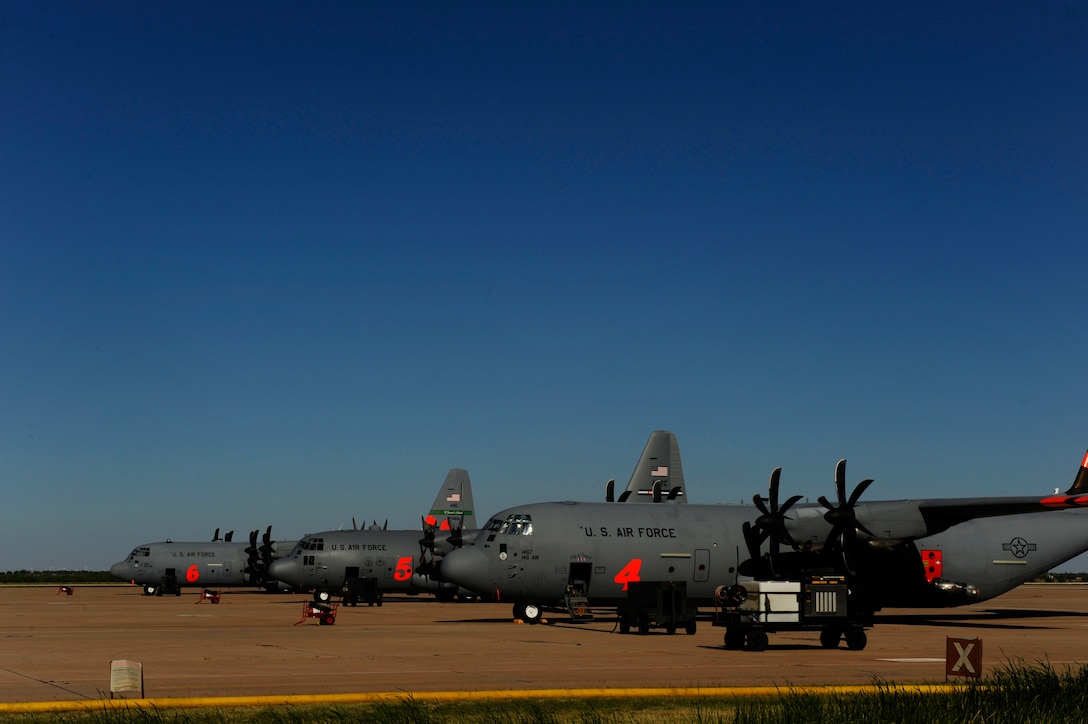 Airmen from 146th Airlift Wing, California Air National Guard and the 302nd Airlift Wing, Colorado Springs Air Force Reserve, conduct firefighting operations at Dyess Air Force Base, Texas, April 27, 2011.  The Airmen maintain and operate the Modular Airborne Firefighting System(MAFFS) housed aboard a C-130 Hercules which is capable of dispensing 3,000 gallons of water or fire retardant in under 5 seconds.  The wildfires have spread across various parts of Texas and have burned more than 1,000 square miles of land.  (U.S. Air Force Photo/Staff Sgt. Eric Harris)