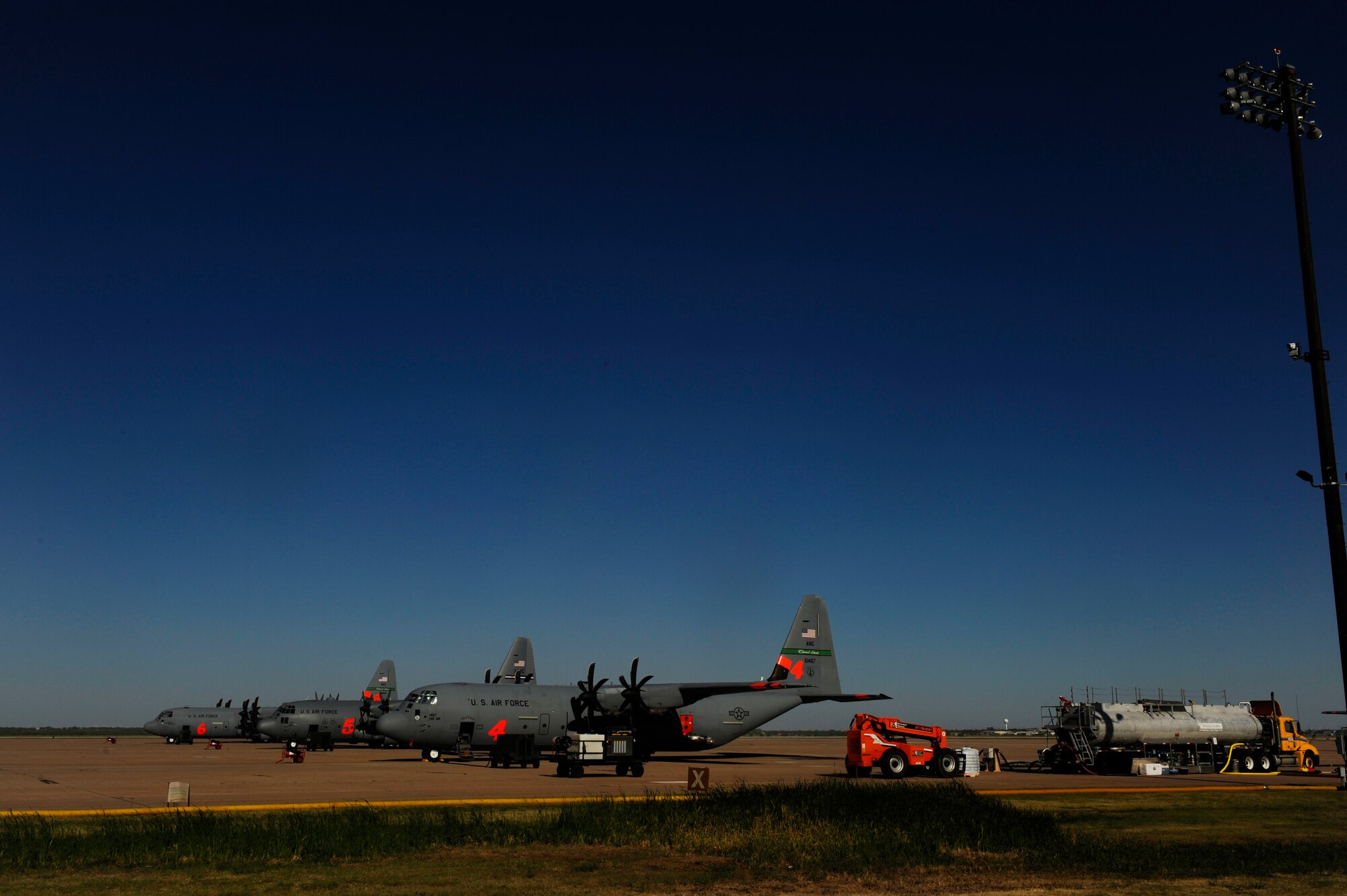 Airmen from 146th Airlift Wing, California Air National Guard and the 302nd Airlift Wing, Colorado Springs Air Force Reserve, conduct firefighting operations at Dyess Air Force Base, Texas, April 27, 2011.  The Airmen maintain and operate the Modular Airborne Firefighting System(MAFFS) housed aboard a C-130 Hercules which is capable of dispensing 3,000 gallons of water or fire retardant in under 5 seconds.  The wildfires have spread across various parts of Texas and have burned more than 1,000 square miles of land.  (U.S. Air Force Photo/Staff Sgt. Eric Harris)