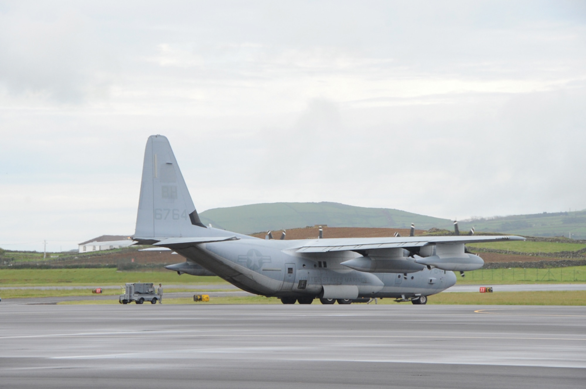 A Navy C-130 Hercules from the 2nd Marine Aircraft Wing at Cherry Point, N.C., stops at Lajes Field before returning to its home station April 25, 2011.  The aircraft received more than 300 gallons of fuel.  (Photo by Tech. Sgt. Chyrece Campbell)
