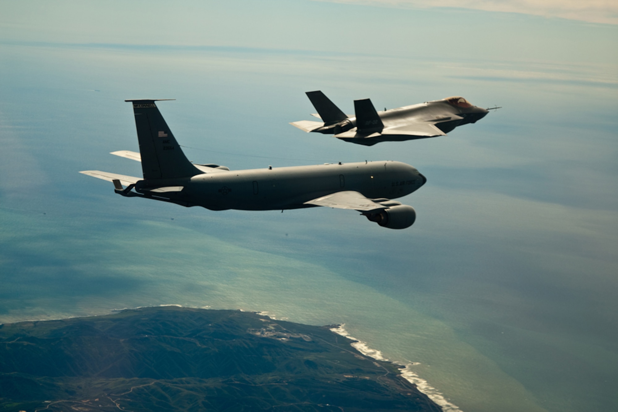 A KC-135R Stratotanker from the 916th Air Refueling Wing flies along with the Air Force's newest fighter, the F-35.Lightning II. This Air Force Reserve wing was the first in Air Mobility Command to refuel the new joint strike fighter. (USAF photo by Darin Russell)