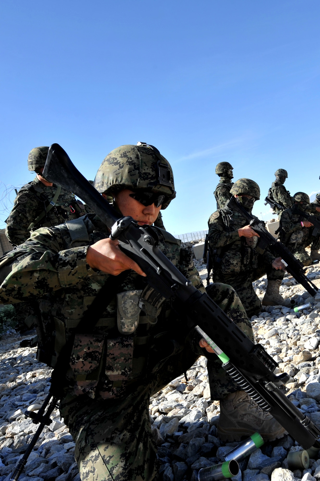 Staff Sergeant Yoohyun Je, Republic of Korea army security forces, loads a 40mm sponge round at Bagram Airfield, Afghanistan, April 22, 2011. The 40mmrounds are used to provide a standoff capability with riot and crowd control. (U.S. Air Force photo by Senior Airman Sheila deVera)