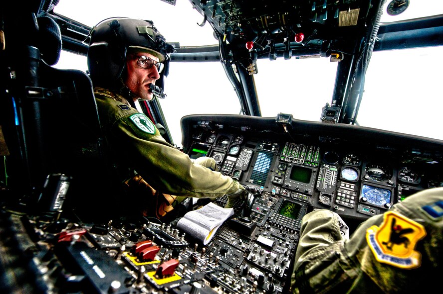 Capt. Gabriel Brown takes command of an HH-60 Pave Hawk helicopter during a routine training mission at Kadena Air Base, Japan. Captain Brown served as the downrange operations director for rescue flights Pedro 83 and 84 while deployed to Afghanistan in the fall of 2010. He and 12 other Airmen from the 33rd Rescue Squadron are being recognized as the recipients of the 2010 "Jolly Green Association Rescue Mission of the Year" award. This marks the third year in a row that the rescue squadron has claimed the award. (U.S. Air Force photo illustration/Staff Sgt. Jonathan Steffen and Senior Airman Shaunlee Hostutler)