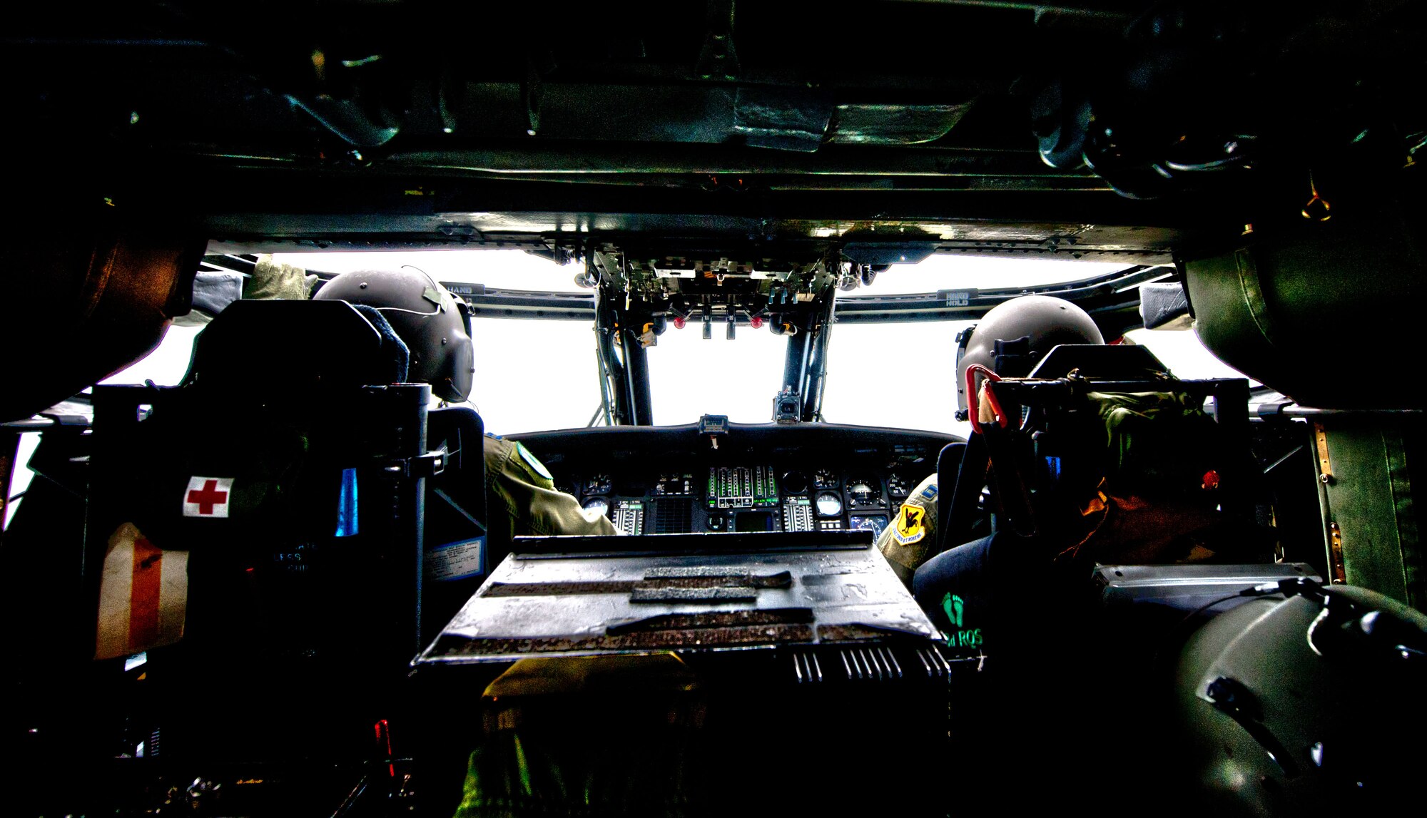 Capt. Gabriel Brown takes command of an HH-60 Pave Hawk helicopter during a routine training mission at Kadena Air Base, Japan. Captain Brown served as the downrange operations director for rescue flights Pedro 83 and 84 while deployed to Afghanistan in the fall of 2010. He and 12 other Airmen from the 33rd Rescue Squadron are being recognized as the recipients of the 2010 "Jolly Green Association Rescue Mission of the Year" award. This marks the third year in a row that the rescue squadron has claimed the award. (U.S. Air Force photo illustration/Staff Sgt. Jonathan Steffen and Senior Airman Shaunlee Hostutler)