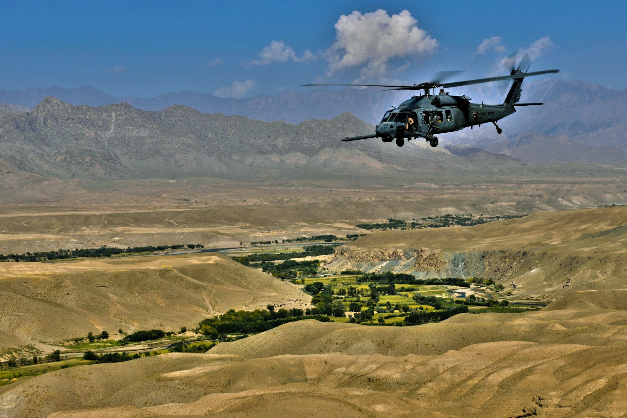 A deployed HH-60G Pave Hawk from Kadena's 33rd Rescue Squadron flies through a valley near Bagram Airfield, Afghanistan, Sept. 24, 2010. (U.S. Air Force photo illustration/ Staff Sgt. Christopher Boitz and Senior Airman Shaunlee Hostutler) 