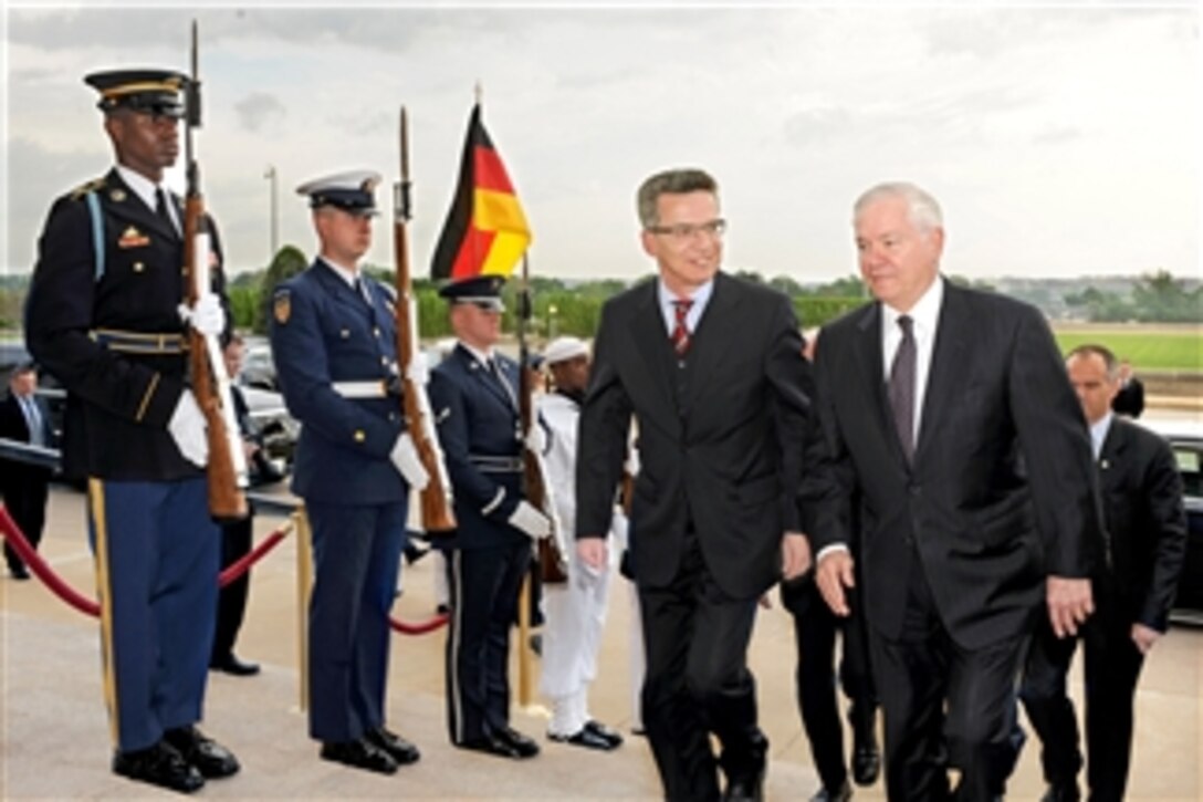 Secretary of Defense Robert M. Gates (right) escorts German Defense Minister Thomas De Maiziere through an honor cordon and into the Pentagon on April 28, 2011.  Gates and Maiziere will meet to discuss a range of mutually important security issues.  