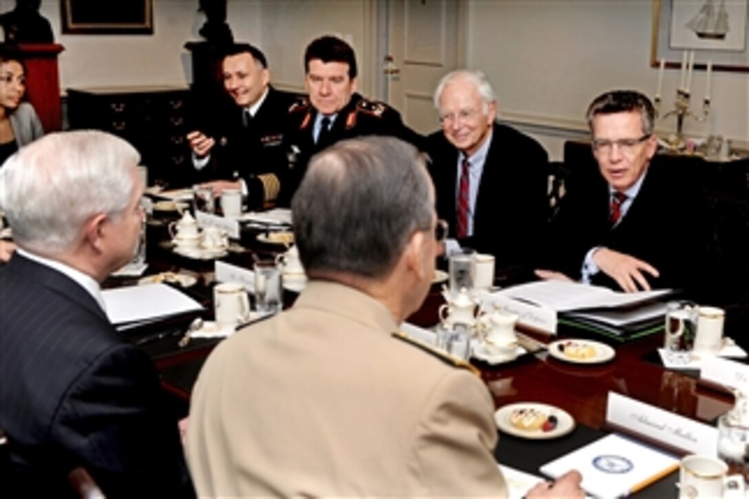 Secretary of Defense Robert M. Gates (left) and Chairman of the Joint Chiefs of Staff Adm. Mike Mullen host a Pentagon meeting with a German defense delegation led by Minister of Defense Thomas de Maiziere (right) on April 28, 2011.  Other attendees are German Ambassador to the United States Klaus Scharioth (2nd from right), Assistant for Politico-military Affairs and Arms Control Maj. Gen. Karl Mullner and Executive Officer to the Minister of Defense German Navy Capt. Carsten Stawitzki (5th from right).  