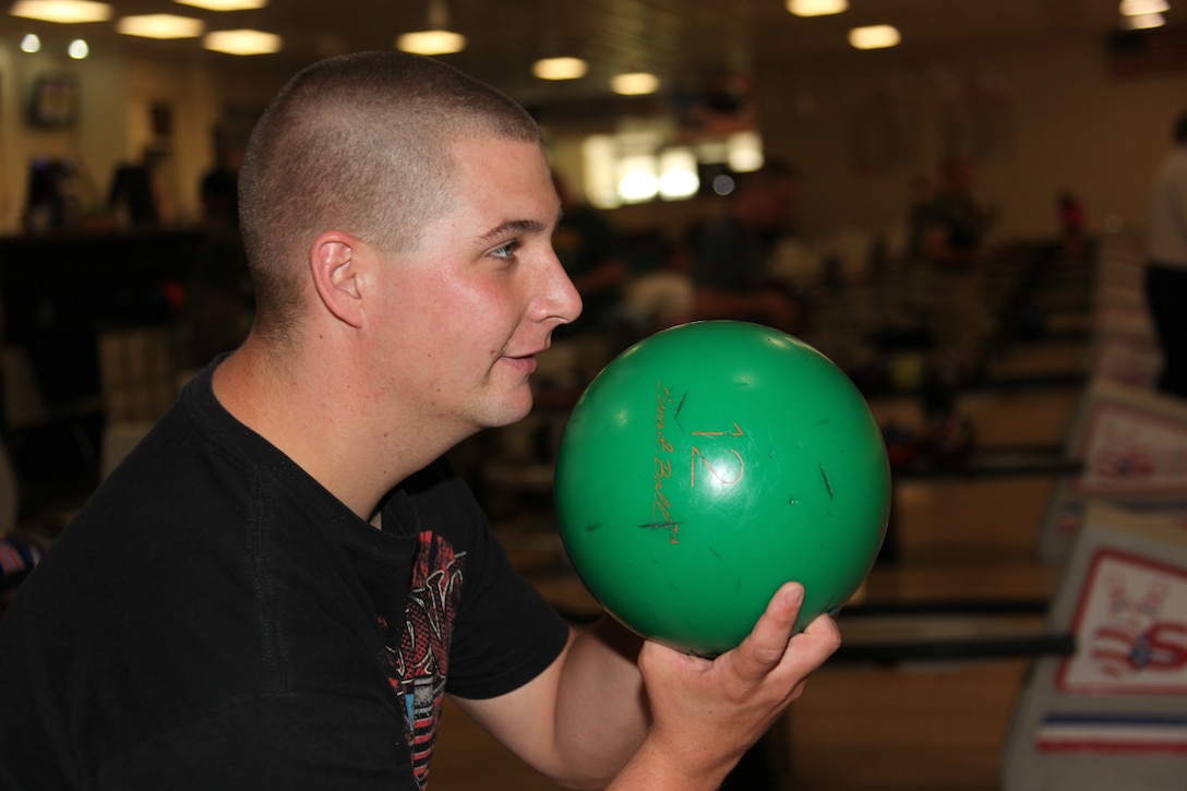 Lance Cpl. Andrew R. Richards prepares to start his approach during the Navy-Marine Corps Relief Society Bowling Tournament at the Stars N’ Strikes Bowling Alley April 29. The competitors paid $15 for their entry fees and got to play three games of Nine Pin No Tap. Richards is a motor-transport mechanic with Marine Air Control Squadron 2.