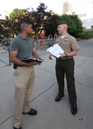 Capt. Ben Roy, an instructor with The Basic School, Marine Corps Base Quantico, Va., introduces himself to Georgia State University student Kris Embry on April 29 and discusses upcoming events for Marine Corps Leadership Seminar - Atlanta. The inaugural event brought together senior Marine leaders and administrators, professors, and students from Atlanta-area colleges and universities for a two-day, hands-on seminar focused on Marine Corps leadership development.