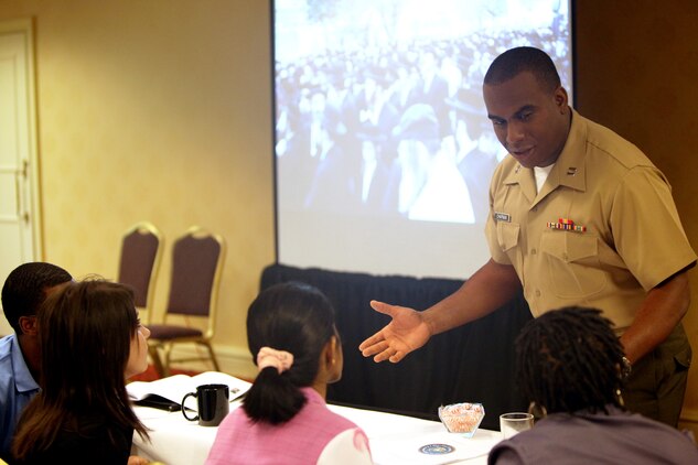 Capt. Maurice Chapman, an instructor with Officer Candidates School, Marine Corps Base, Quantico, Va., discusses leadership traits with Atlanta-area college students during Marine Corps Leadership Seminar - Atlanta April 29.  The inaugural event brought together senior Marine leaders and administrators, professors, and students from Atlanta-area colleges and universities for a two-day, hands-on seminar focused on Marine Corps leadership development.