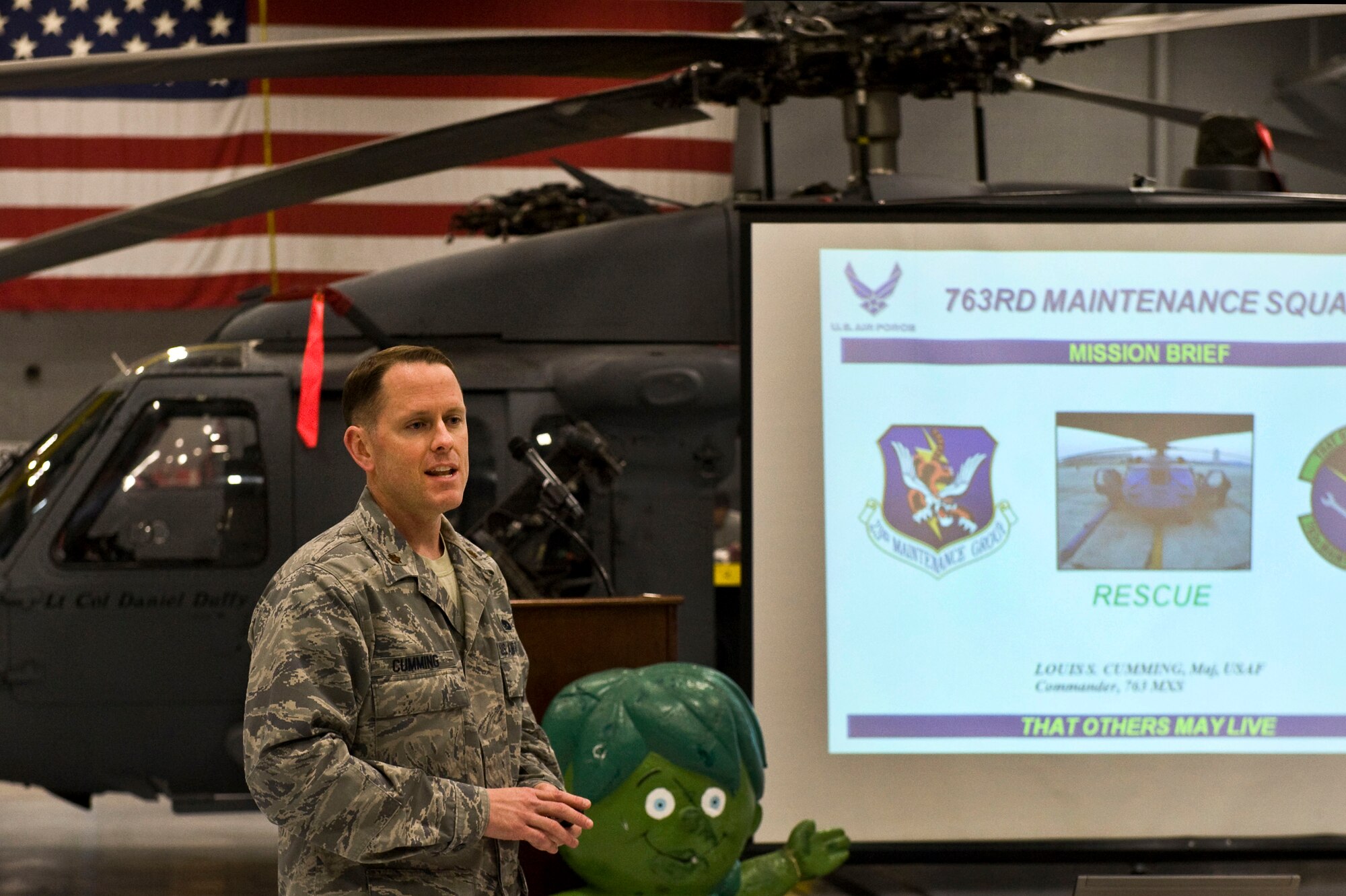 NELLIS AIR FORCE BASE, Nev. -- Maj. Louis Cumming, 763rd Maintenance Squadron, commander, gives a mission briefing to the Nellis Key Spouses group during the Key Spouses quarterly event April 8.  Key Spouses is a base wide organization that allows spouses the opportunity to learn about different aspects of the Air Force while their husbands and wives are deployed. ( U.S Air Force Photo by Airman 1st Class Daniel Hughes)